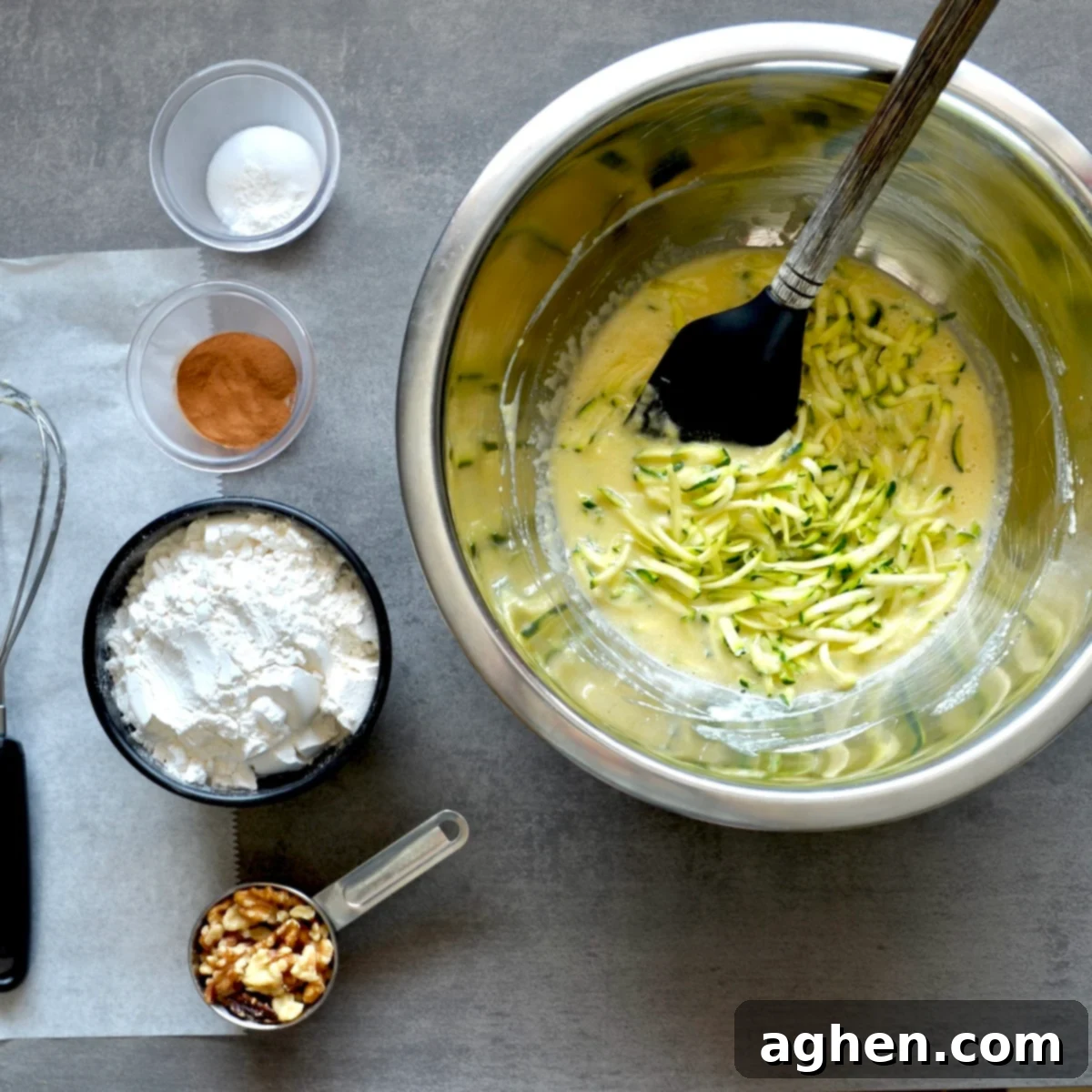 A Classic Weight Watchers Zucchini Walnut Bread 5 Zucchini pieces and batter in a mixing bowl