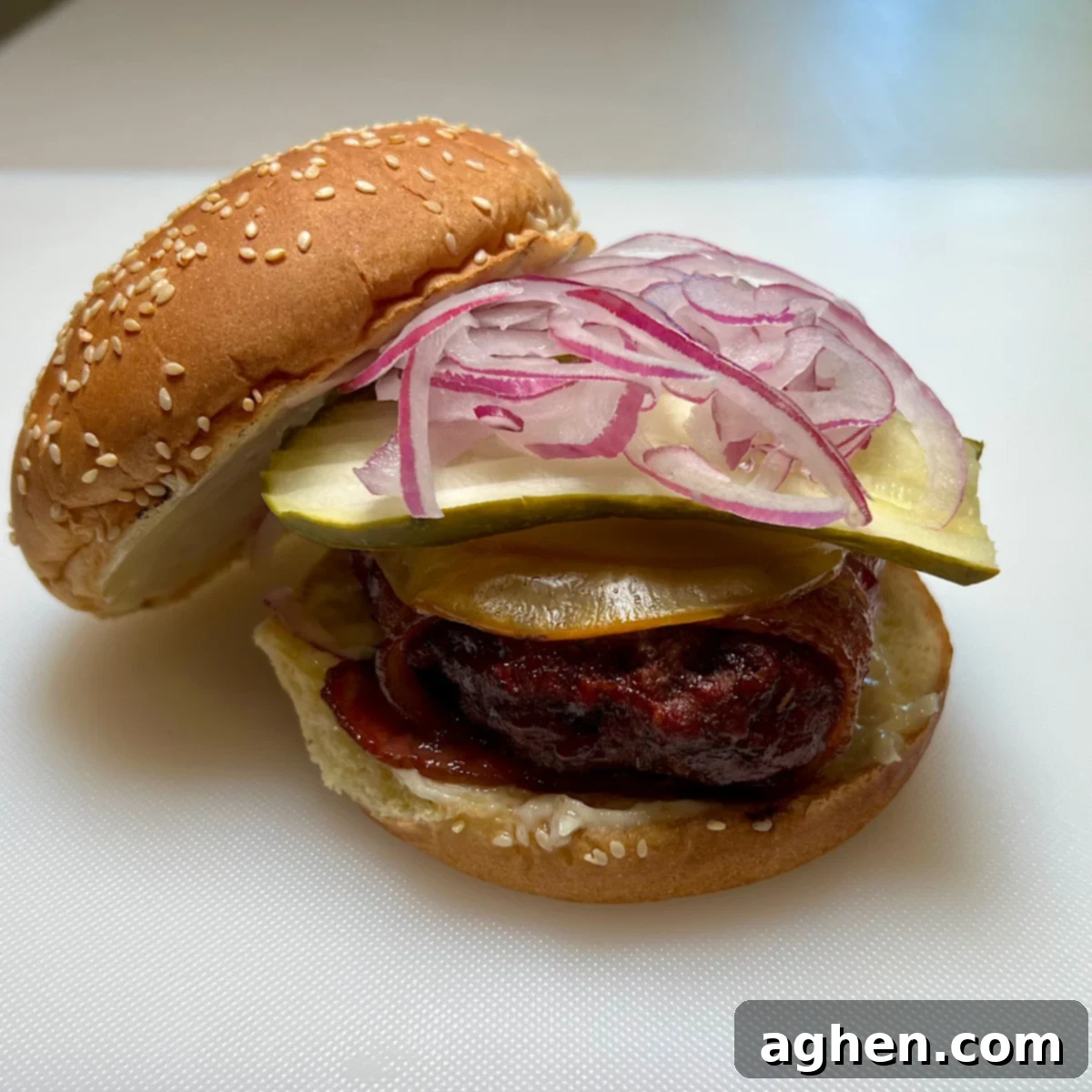 finished bacon bacon burger on burger bun, perfectly smoked with melted cheese