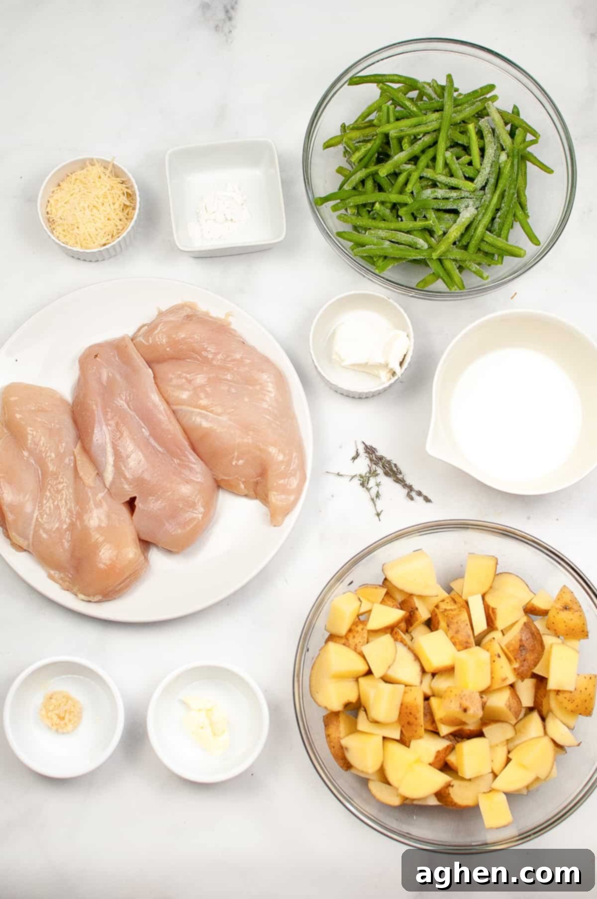 Creamy Garlic Herb Chicken Ingredients: three chicken breasts, green beans, chopped potatoes, milk, minced garlic, flour, cream cheese, shredded Parmesan, fresh thyme, butter