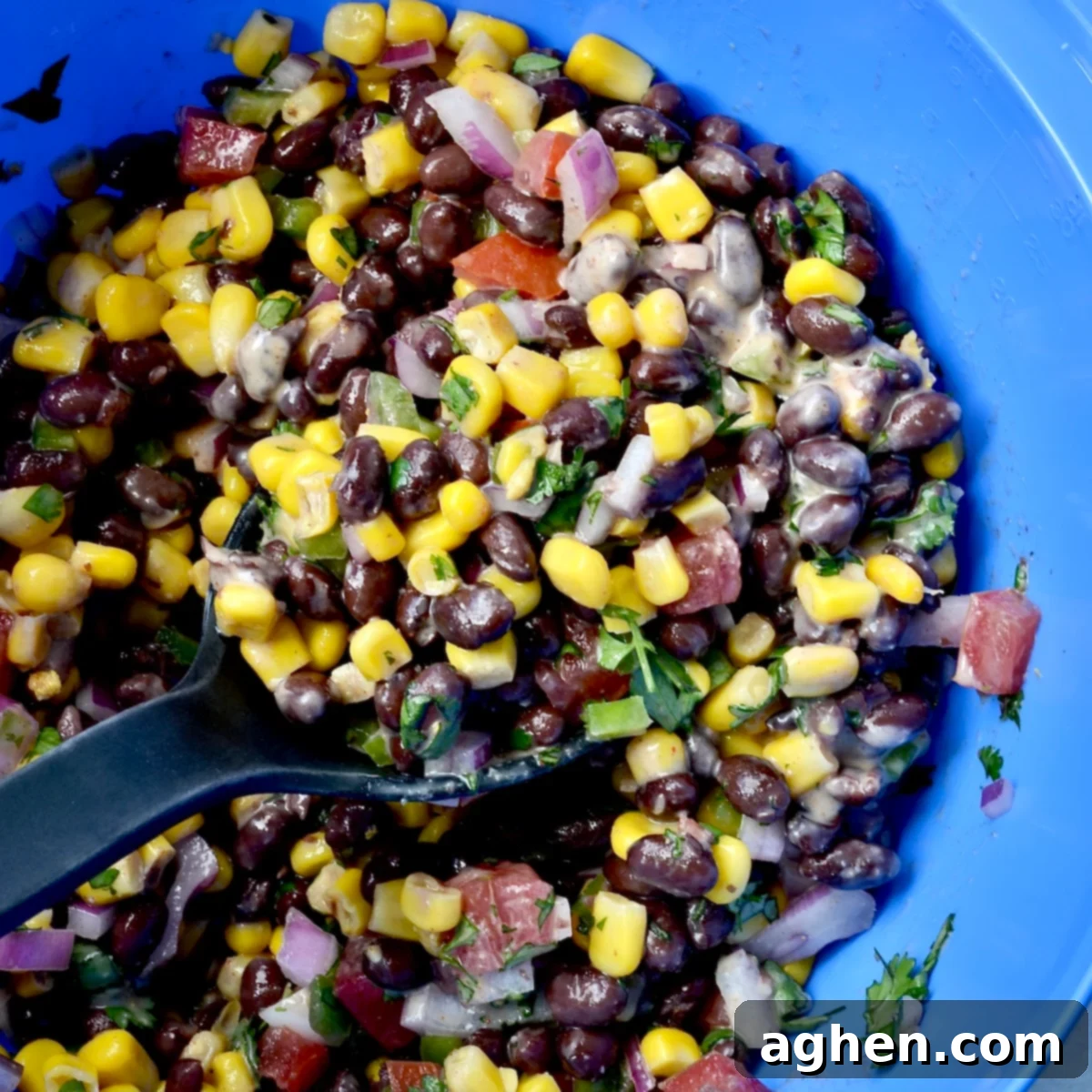 Weight Watchers' Favorite Black Bean and Corn Salad 4 Stirring salad ingredients and dressing