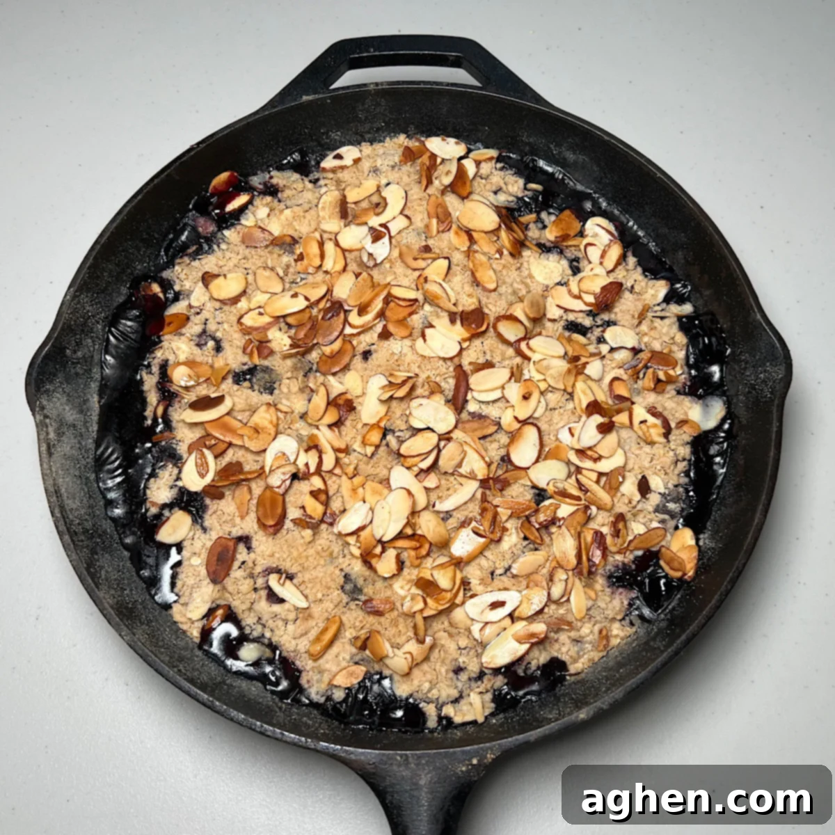 The Ultimate Smoked Blueberry Crumble for Your Grill 11 finished blueberry crumble in cast iron skillet