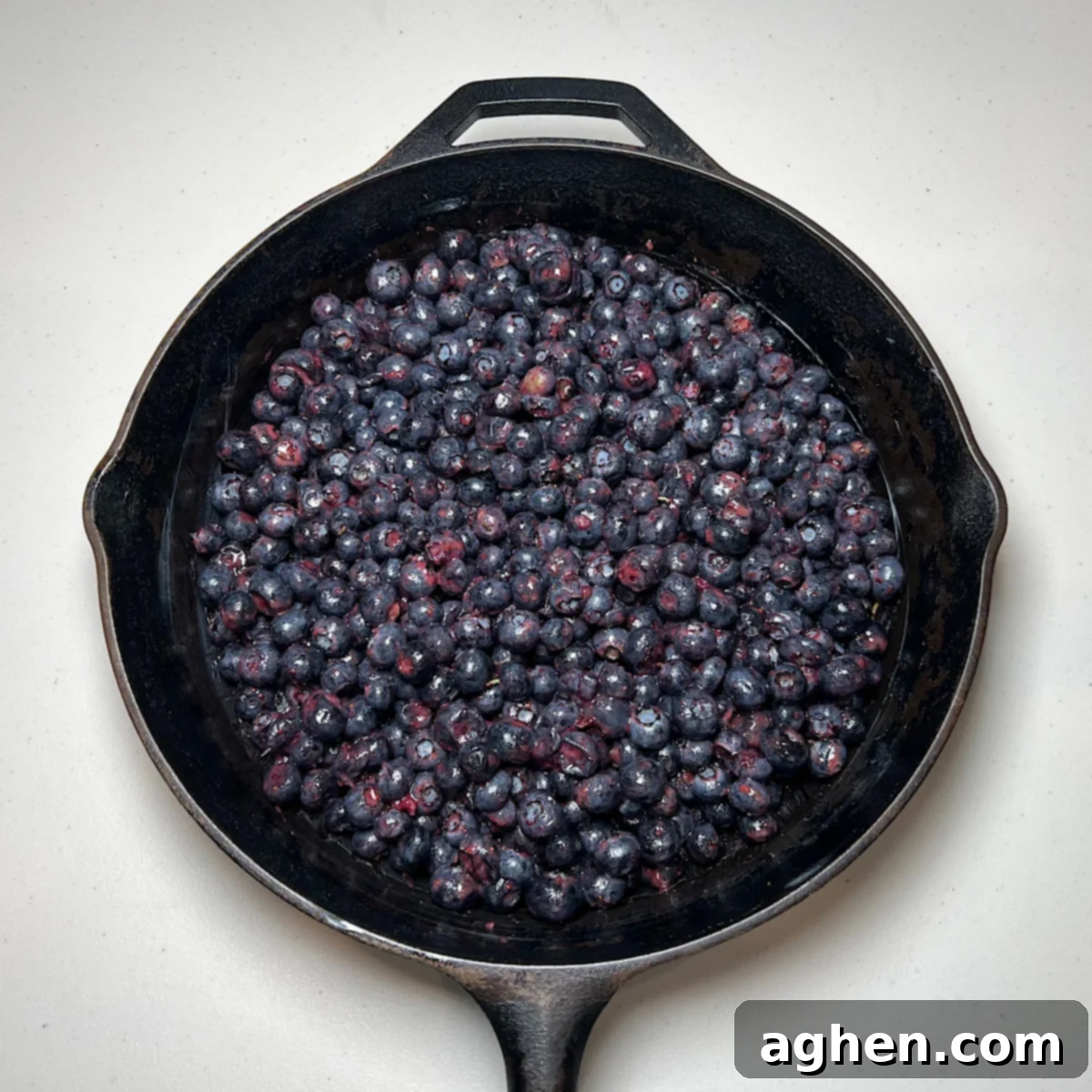 The Ultimate Smoked Blueberry Crumble for Your Grill 7 blueberries in cast iron skillet