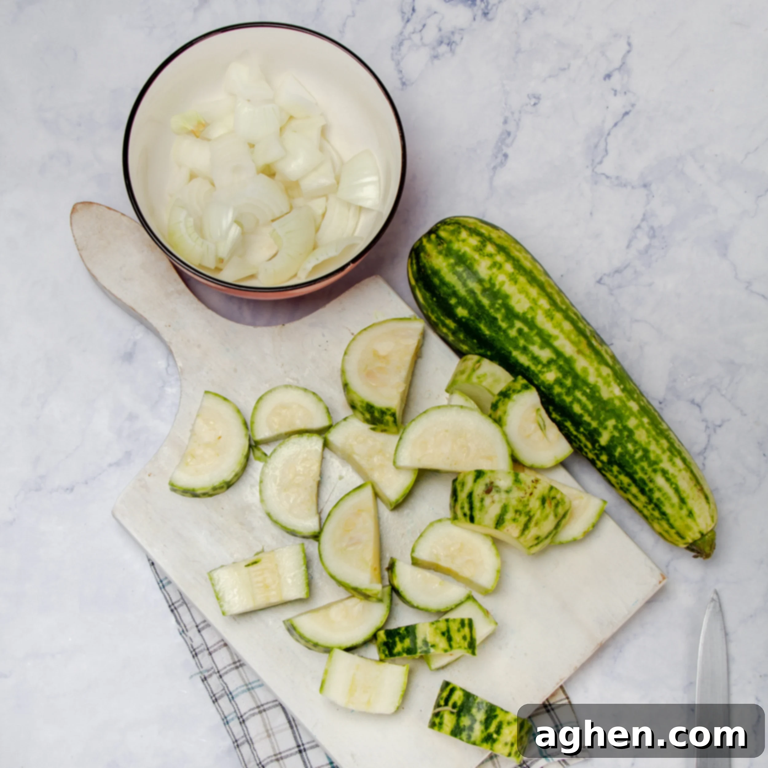 Light Zucchini Cream Soup: A Fun Fresh Spin 4 Onions and zucchini being diced on a cutting board.