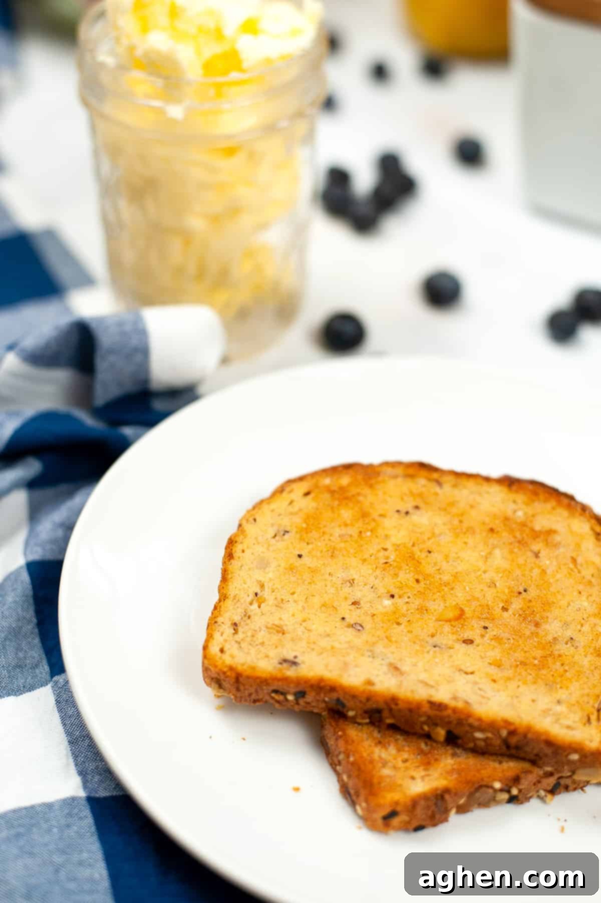 From Cream to Gold 7 Toast with homemade butter in jar in background, showcasing a tasty outcome.