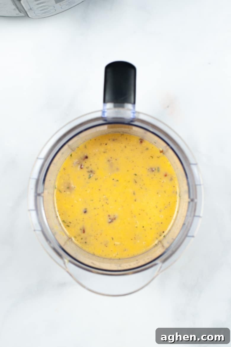 Smooth egg mixture perfectly blended in a blender, ready for pouring into molds