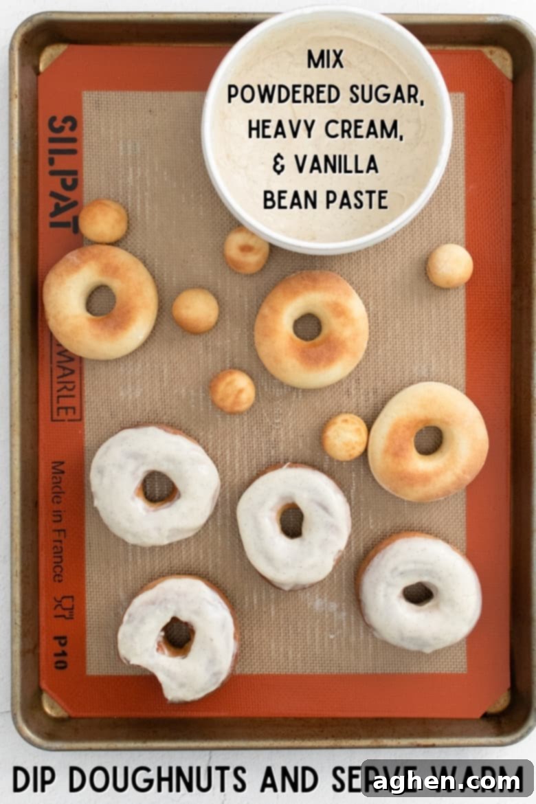 Mix icing, dip doughnuts, and serve warm