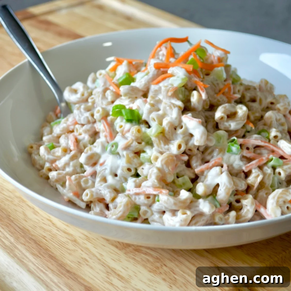 A serving bowl filled with creamy Hawaiian Macaroni Salad, ready to be enjoyed.