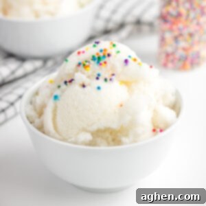 snow ice cream with rainbow sprinkles in a white bowl