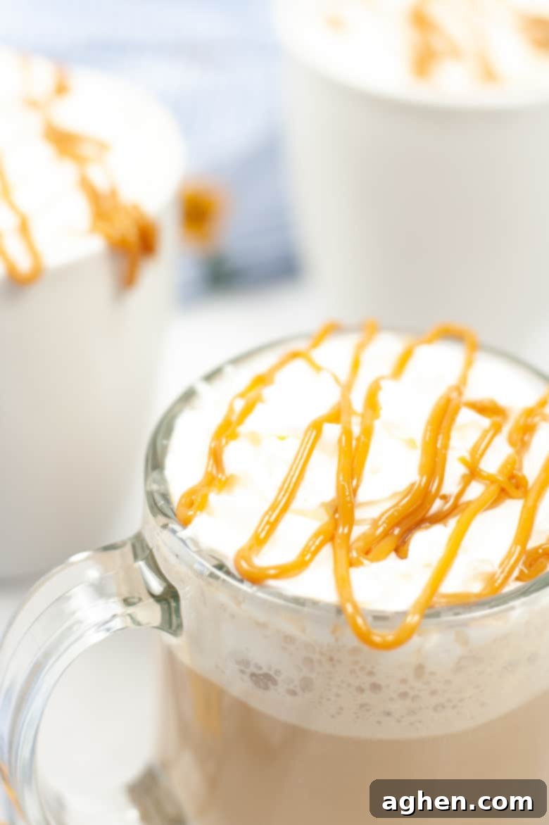 mug of coffee topped with whipped cream and caramel