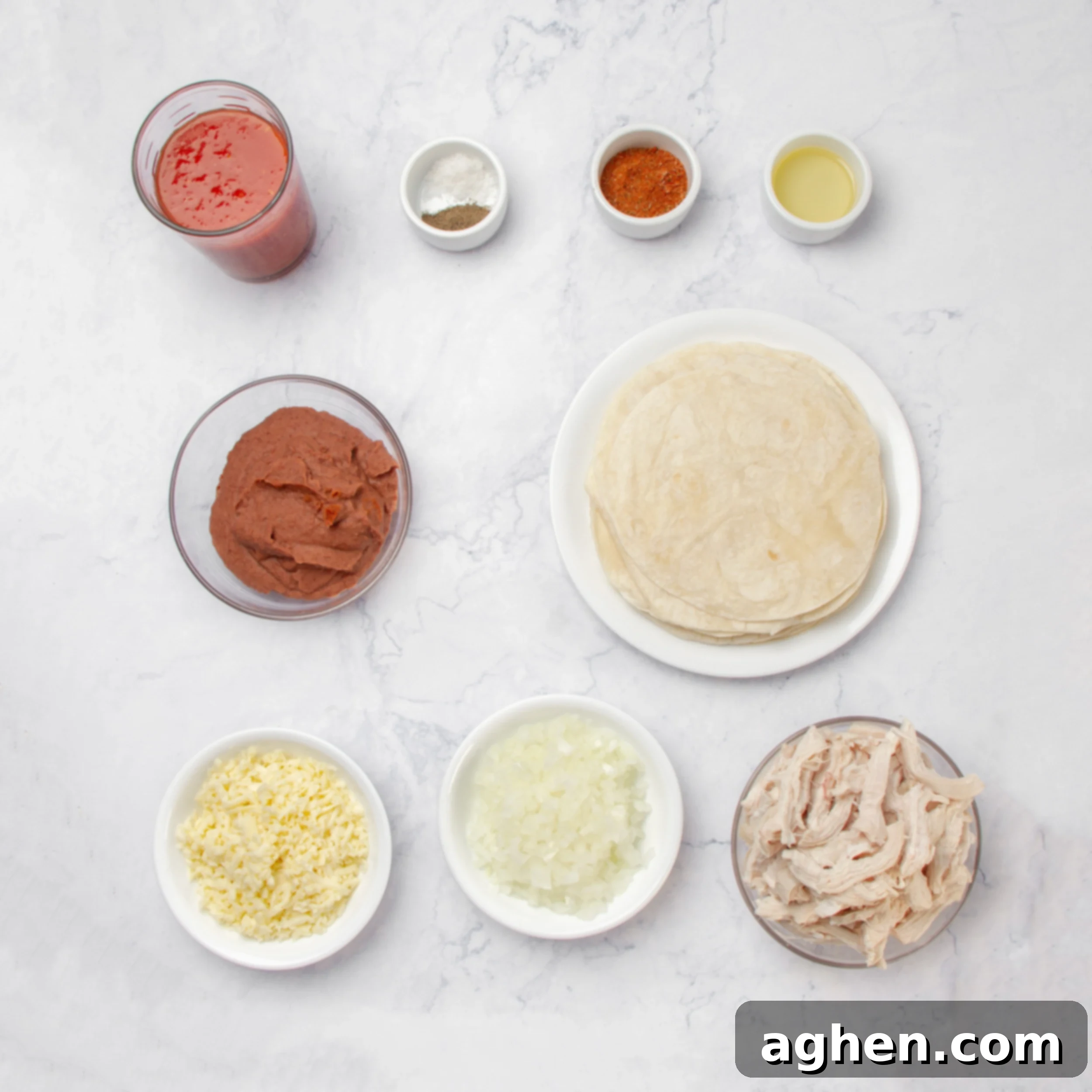 Cheesy Chicken Enchilada Bake 3 Chicken enchilada ingredients in separate dishes on a counter.