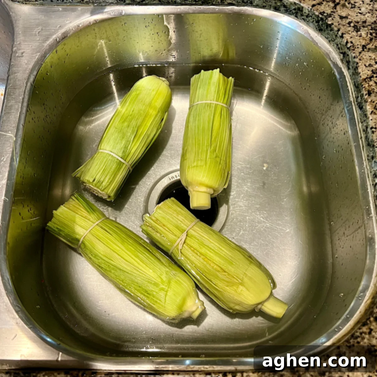 Smoked Corn: The Taste of Summer 11 corn on the cob soaking in water
