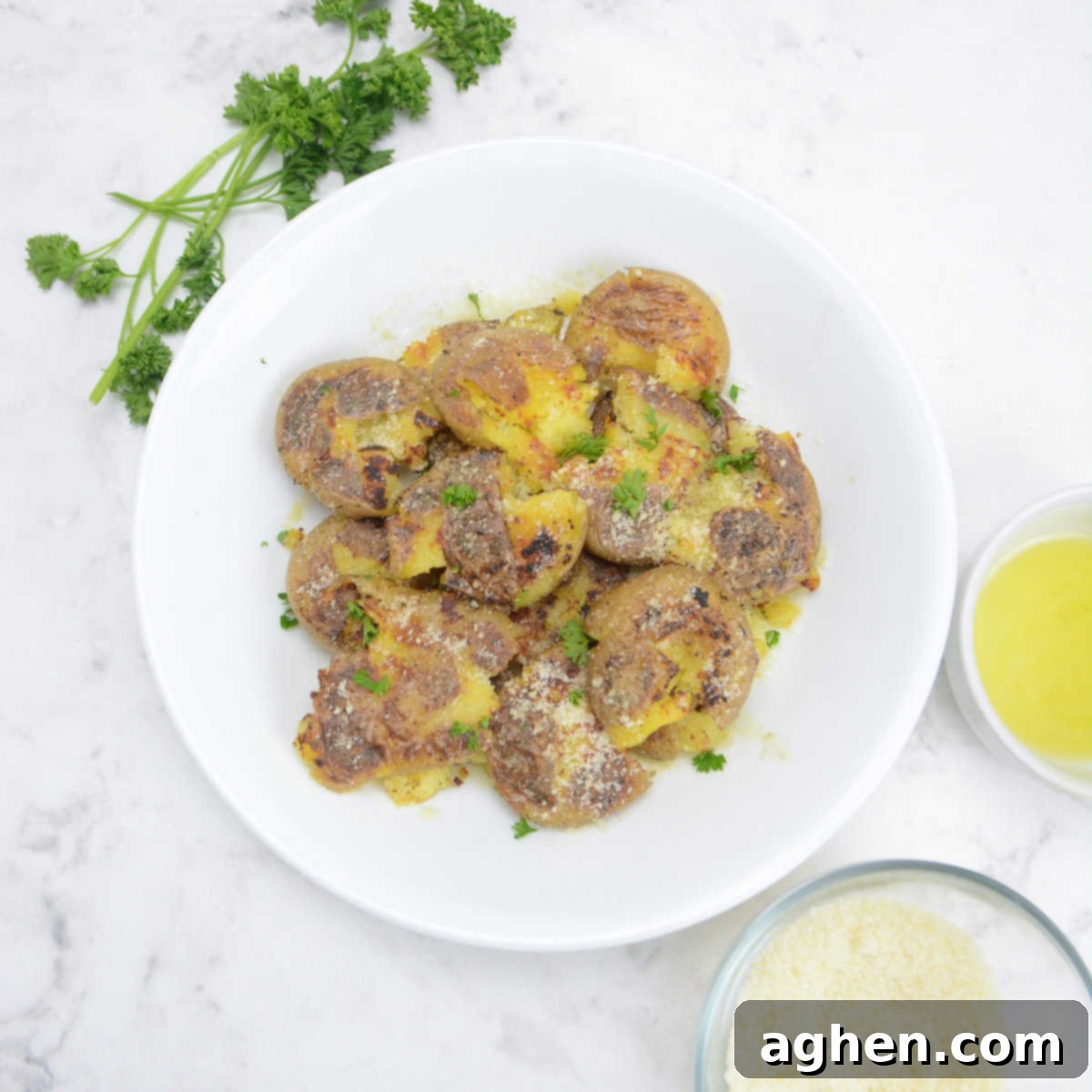 These 15 Recipes Are The Sole Reason My Blackstone Griddle Sees Action In August 9 blackstone smashed potatoes, served in a white shallow bowl.