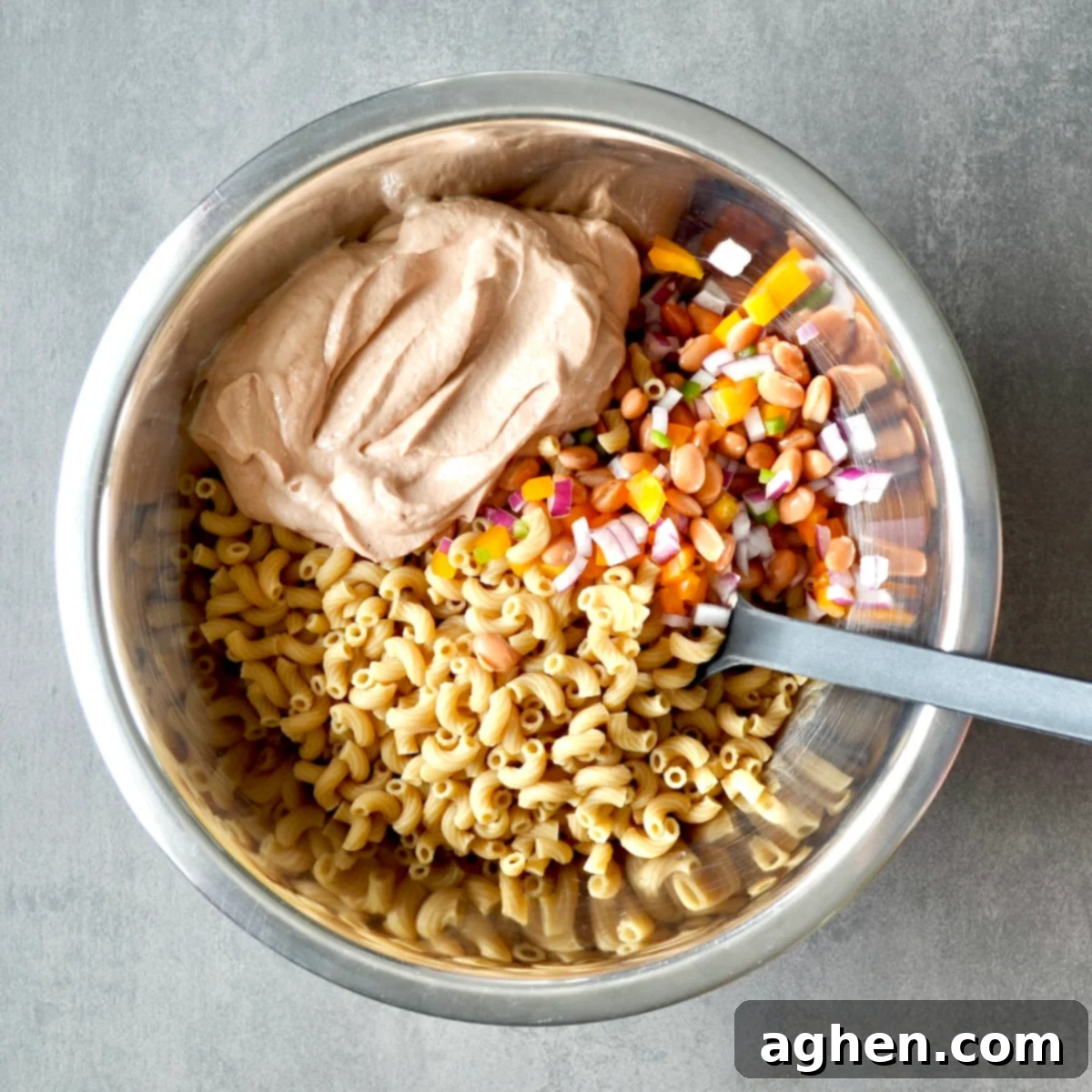 Weight Watchers BBQ Macaroni Salad: The Cookout Favorite That Vanishes First 5 mixing cooked pasta with dressing and vegetables
