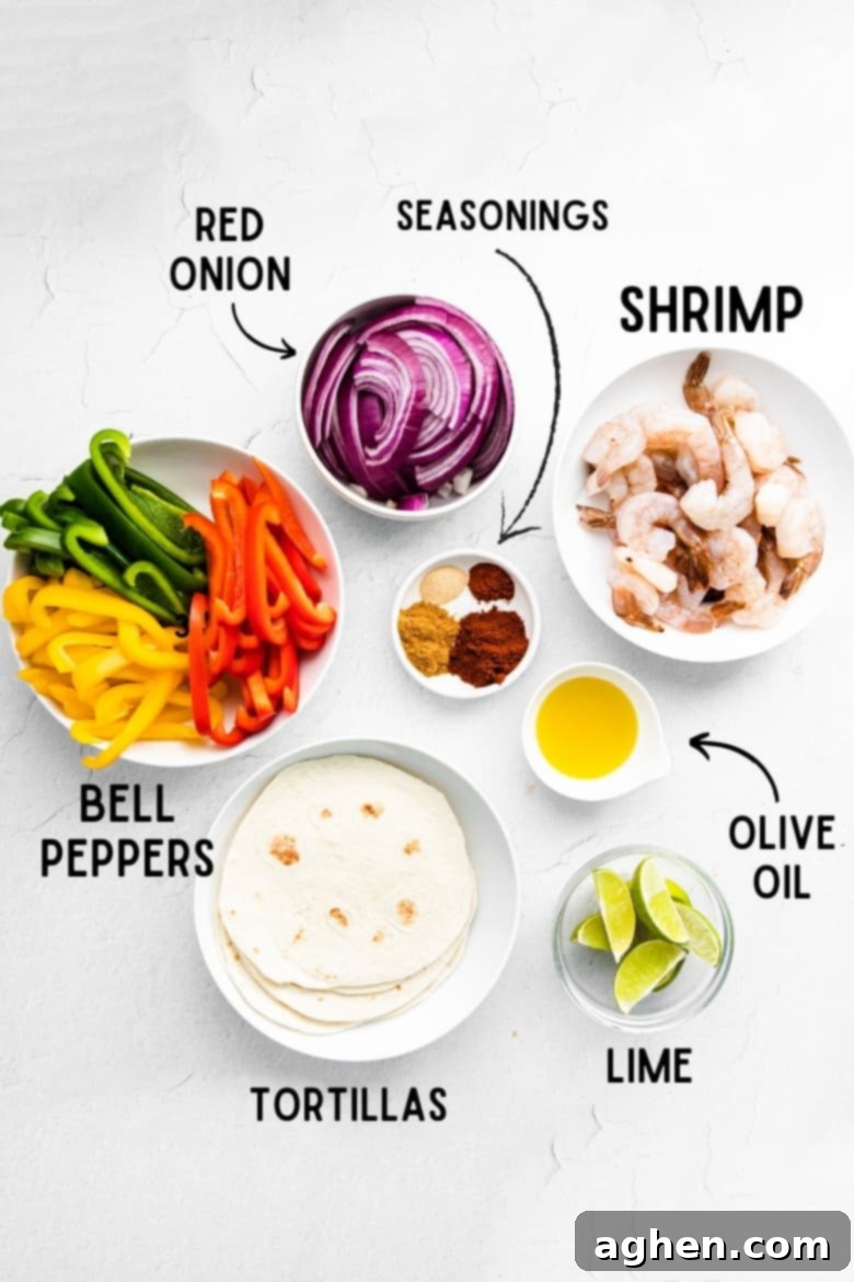 Easy Sheet Pan Shrimp Fajitas 4 Array of fresh ingredients laid out for sheet pan shrimp fajitas: sliced red onion, various seasonings in a small bowl, raw peeled shrimp, lime wedges, olive oil, and vibrant green, orange, and yellow sliced bell peppers.