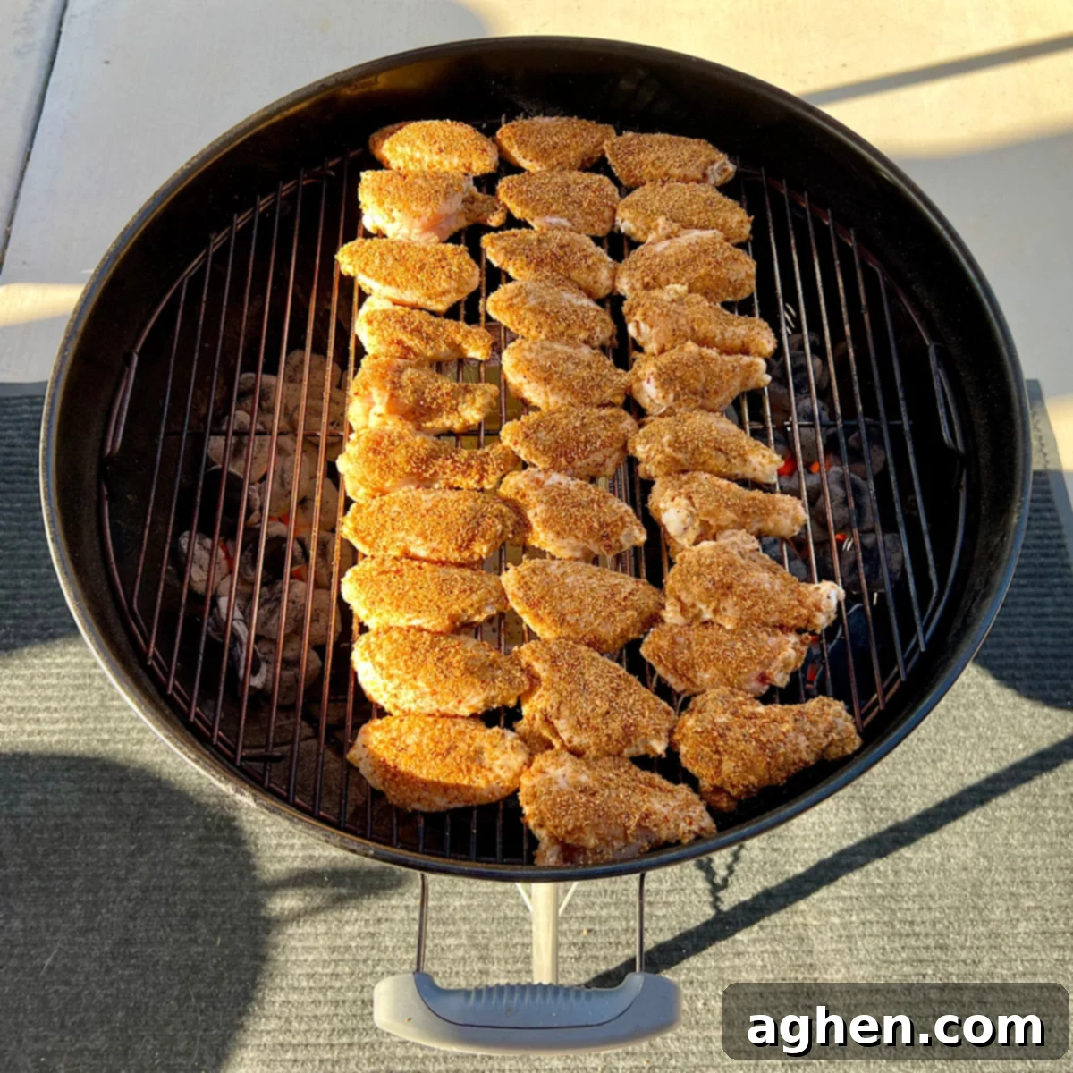 raw chicken on grill grate