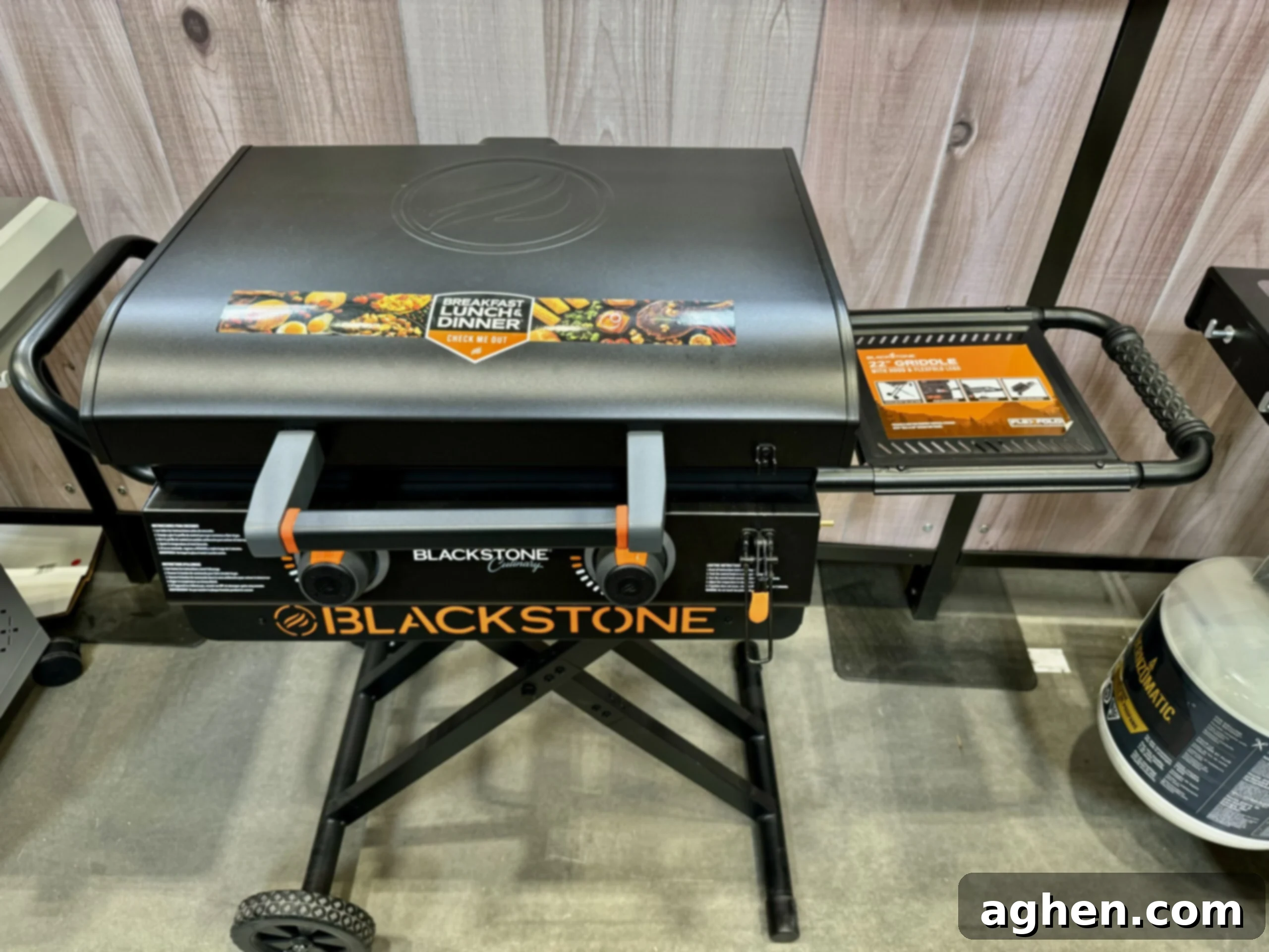 A person cooking on a Blackstone griddle