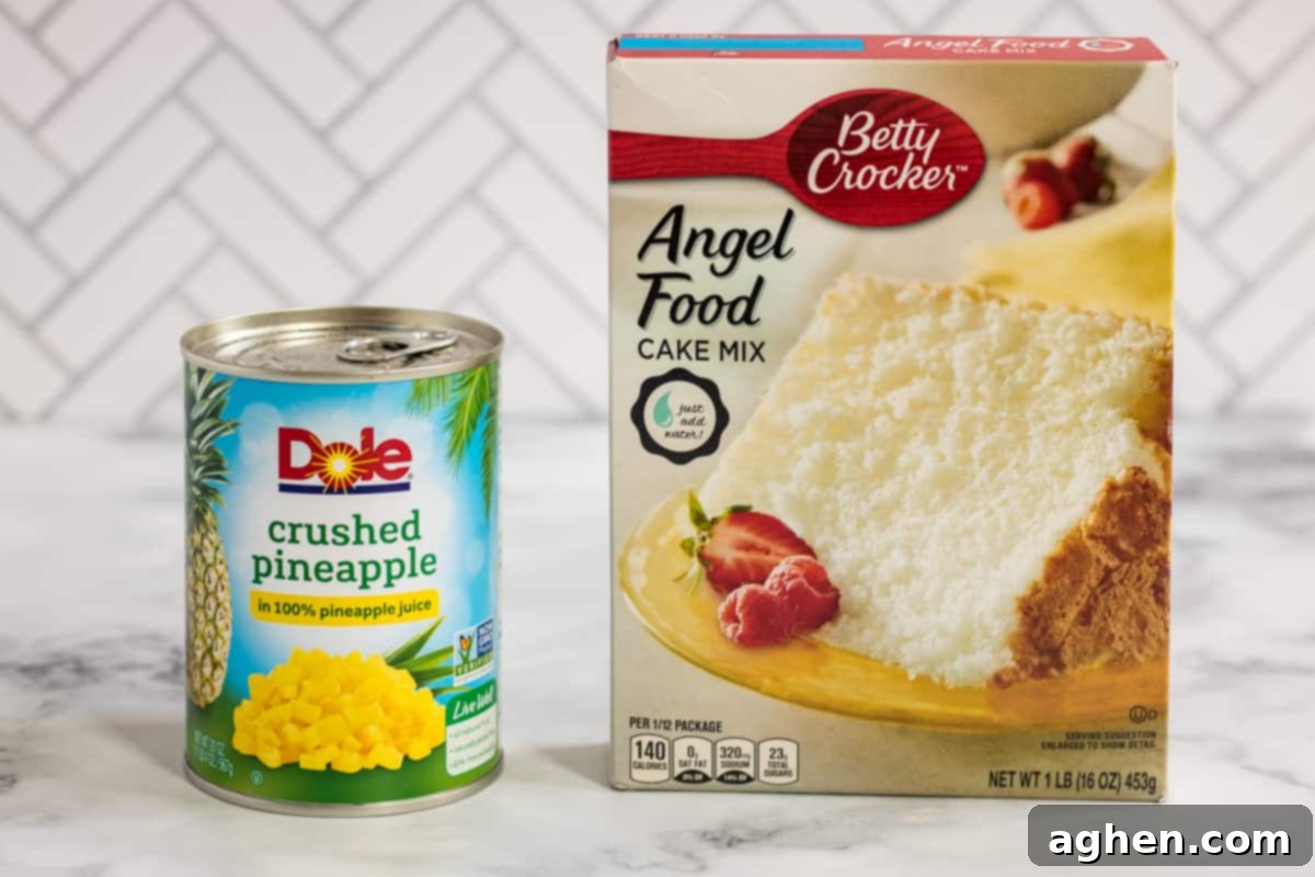 A can of Dole crushed pineapple and a box of Betty Crocker angel food cake mix displayed on a kitchen countertop.