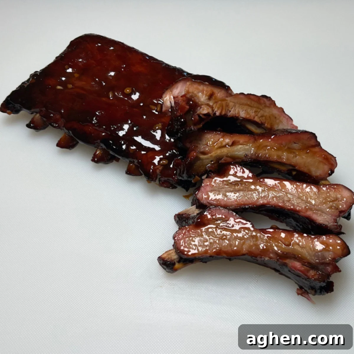 perfectly cut asian glazed smoked baby back ribs