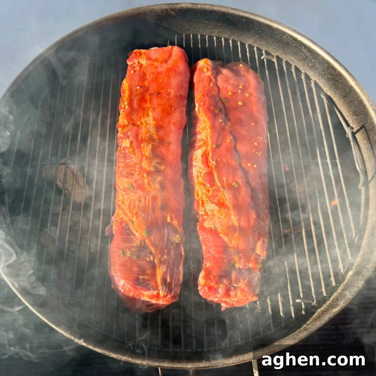 asian glazed pork ribs smoking on weber kettle grill
