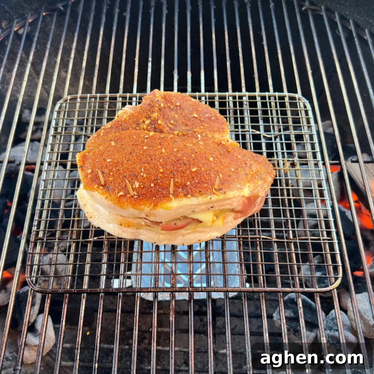 stuffed pork chop on grill grate