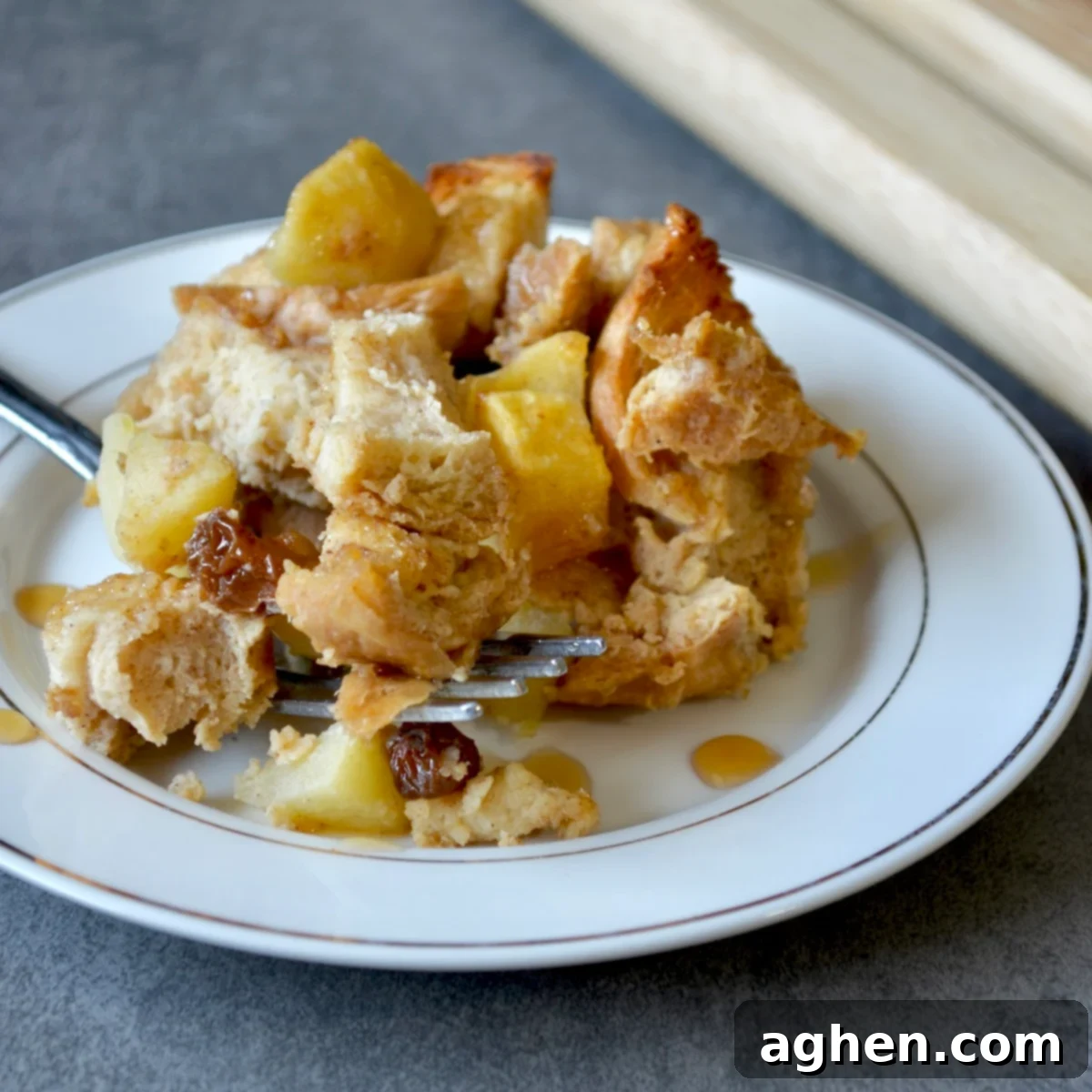 Delightful slice of Weight Watchers apple bread pudding with raisins