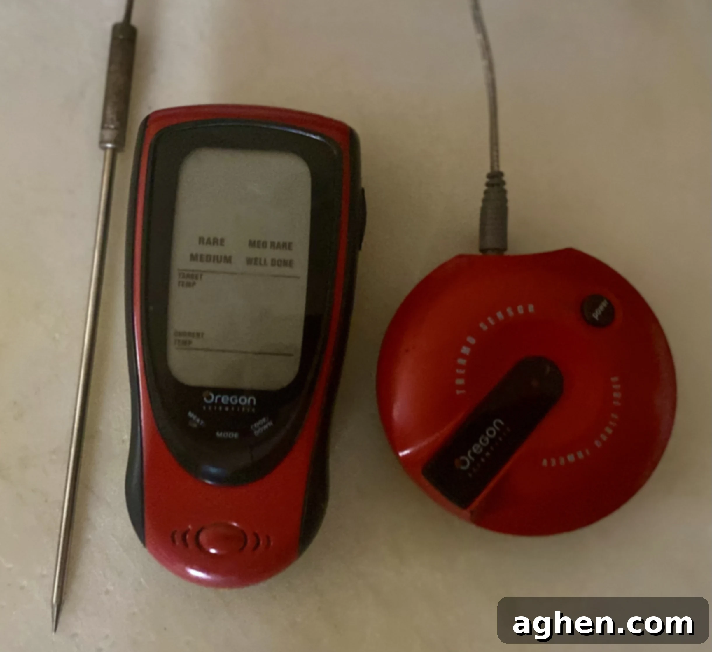 A high-quality instant-read meat thermometer being used to check the internal temperature of a rotisserie-cooked roast, ensuring perfect doneness.
