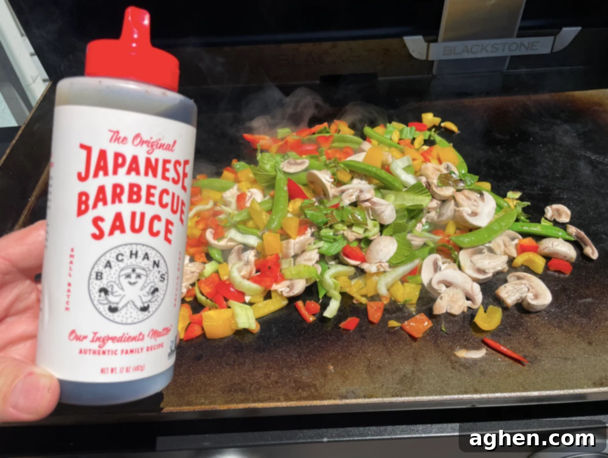 15 Must-Try Store-Bought Sauces for Your Blackstone Griddle 3 Close-up of a Blackstone griddle cooking surface with various ingredients
