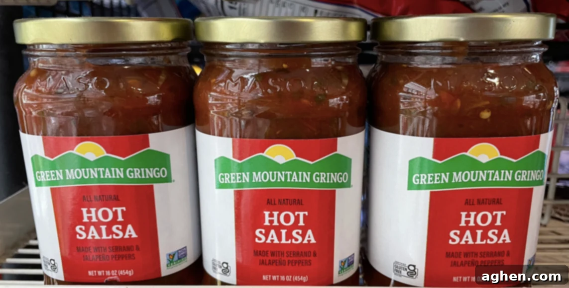 15 Must-Try Store-Bought Sauces for Your Blackstone Griddle 9 Sausage and onions cooking on a Blackstone griddle with guacamole salsa