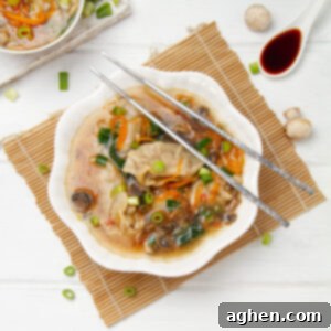 A bowl of light yet hearty Chinese dumpling soup, perfect for a healthy meal.