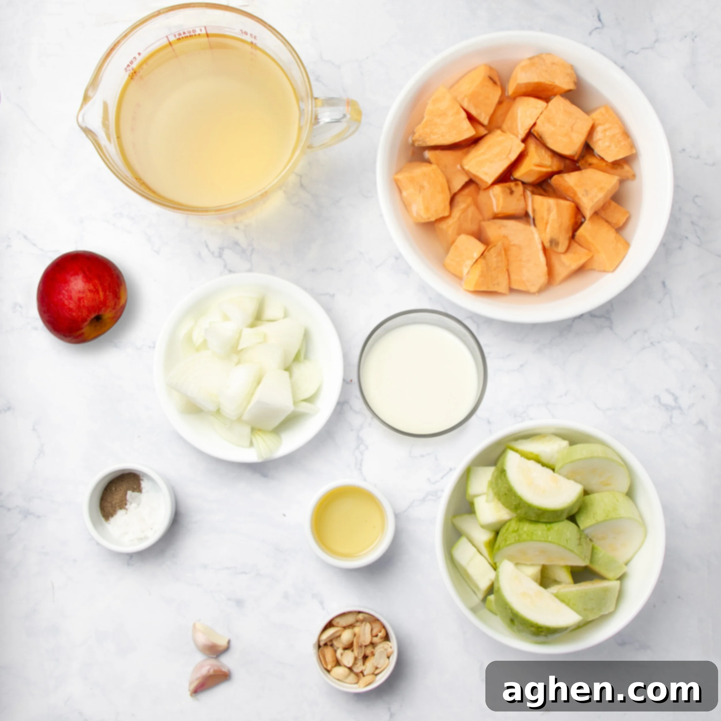 Creamy sweet potato soup ingredients in separate dishes. 