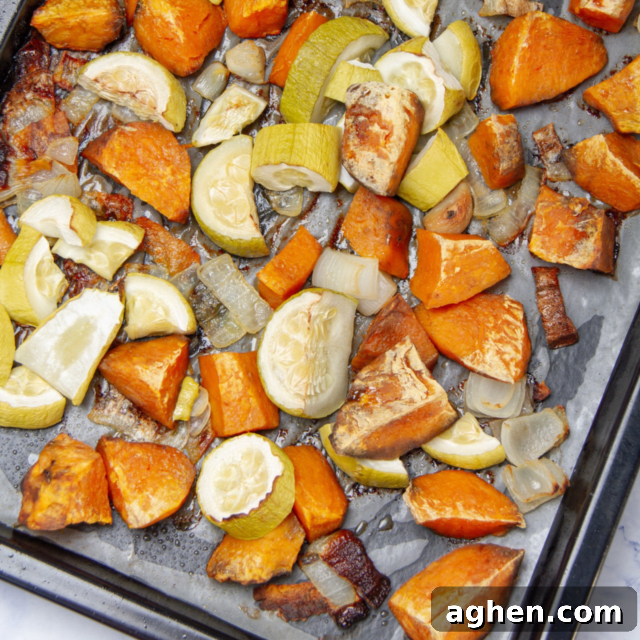Roasted and caramelized vegetables on the sheet pan. 