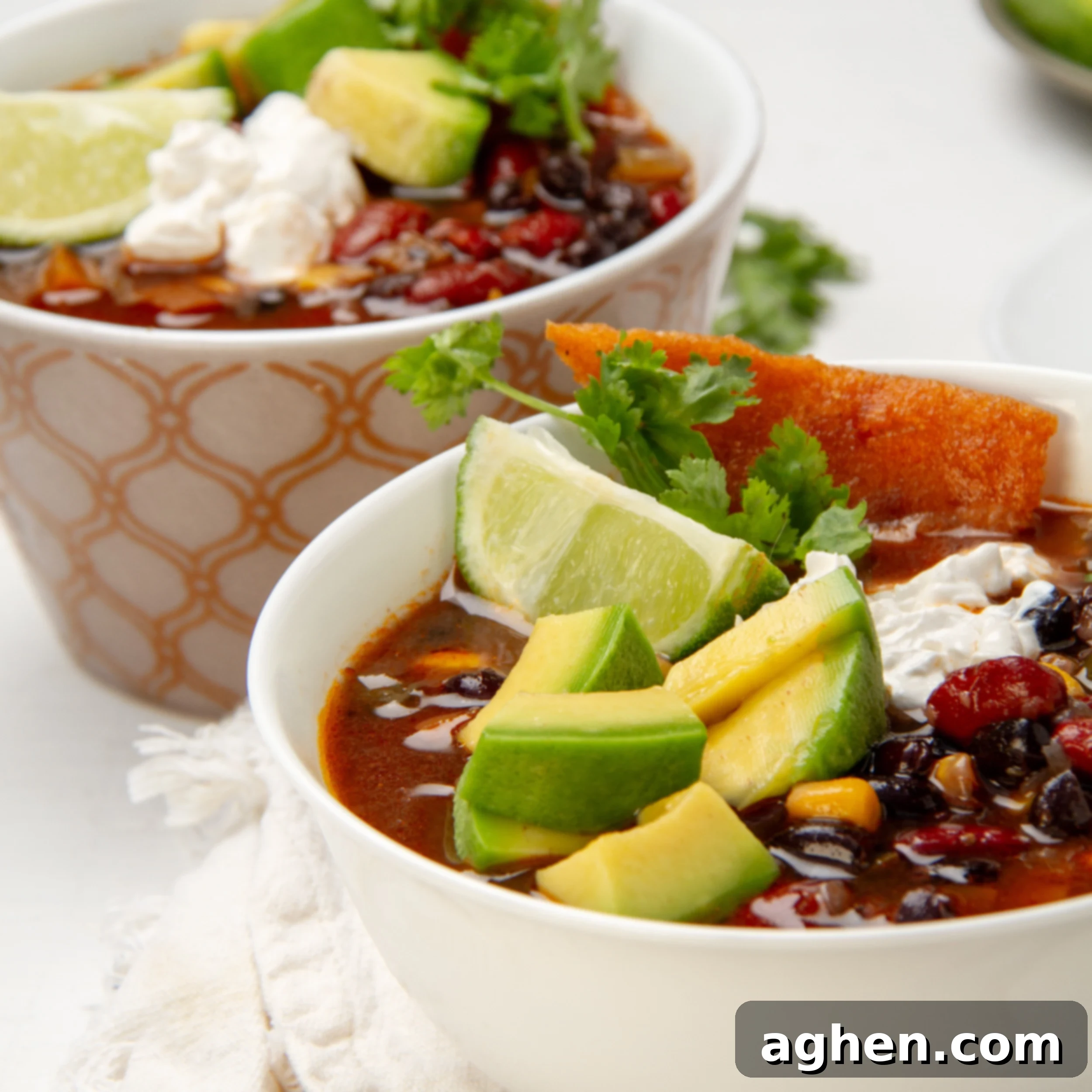 Hearty Instant Pot Vegan Chili 2 Hearty and chunky Instant Pot Vegan Chili in a bowl topped with sliced avocado and fresh cilantro.