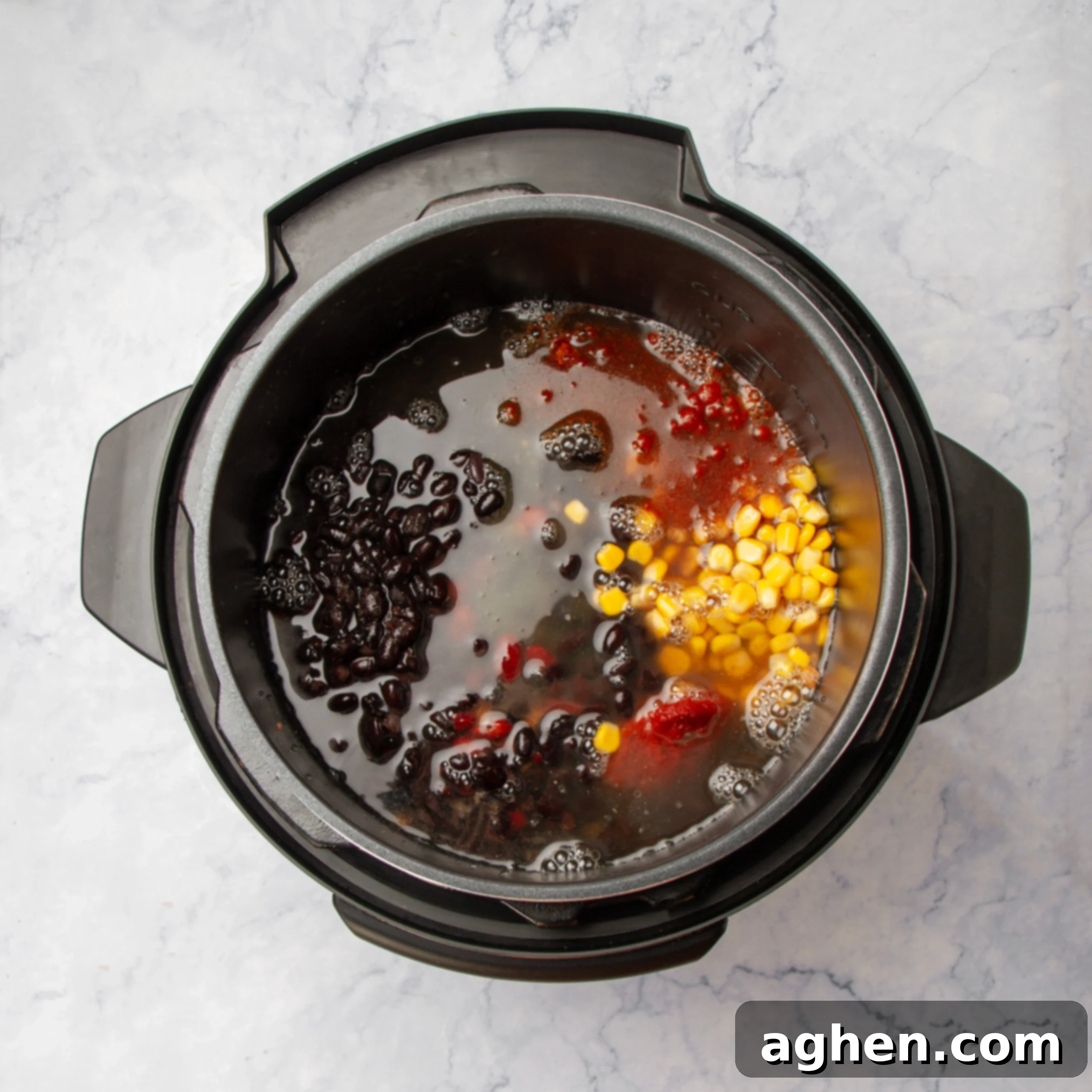 Hearty Instant Pot Vegan Chili 6 All soup ingredients submerged in broth and ready for cooking in the Instant Pot.