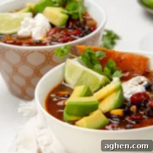 Hearty Instant Pot Vegan Chili 7 Hearty and chunky Instant Pot Vegan Chili in a bowl topped with sliced avocado and fresh cilantro.