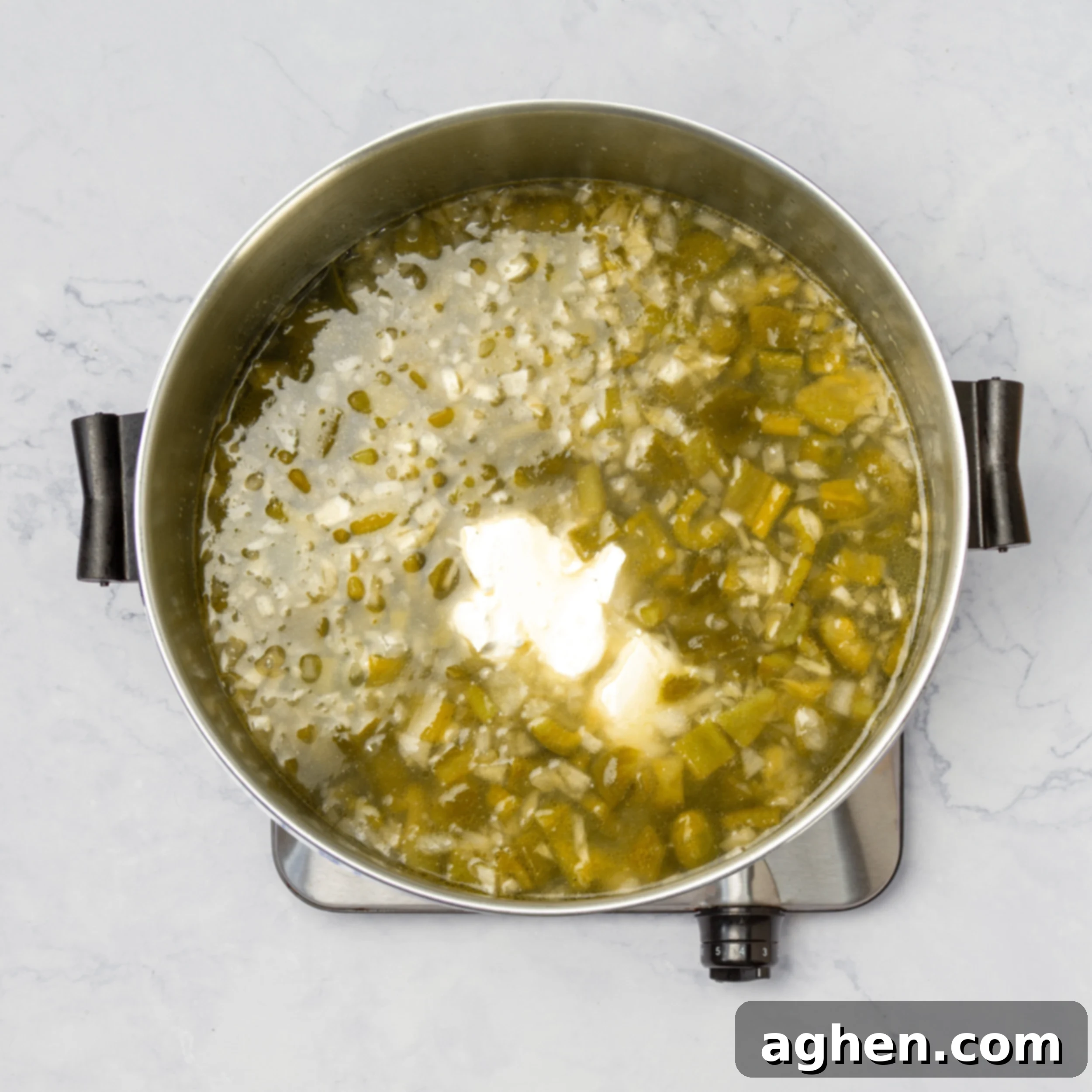 All Chile Relleno Soup ingredients simmering in a pot. 