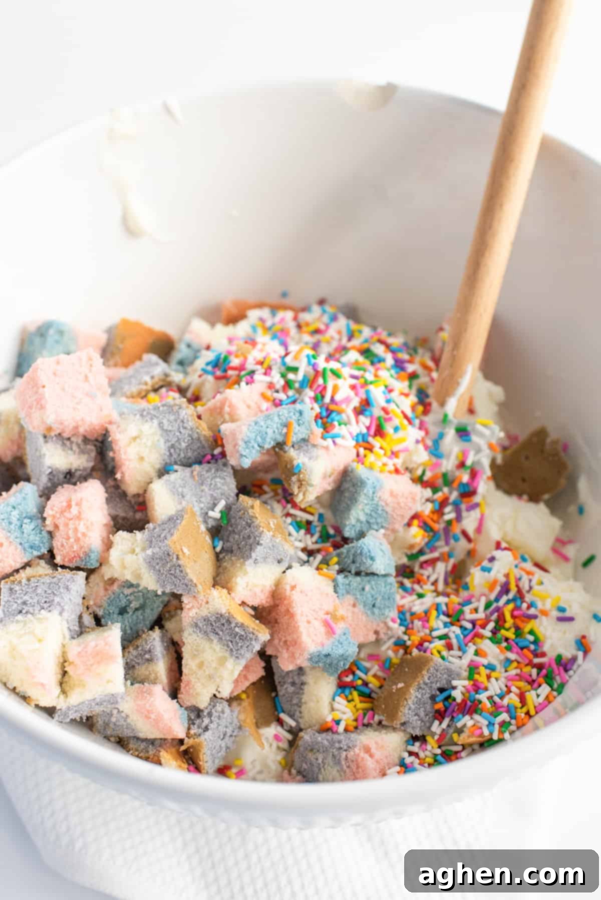 Frozen Dream Pie 7 Mining bowl filled with vanilla ice cream, rainbow sprinkles, and chunks of cake