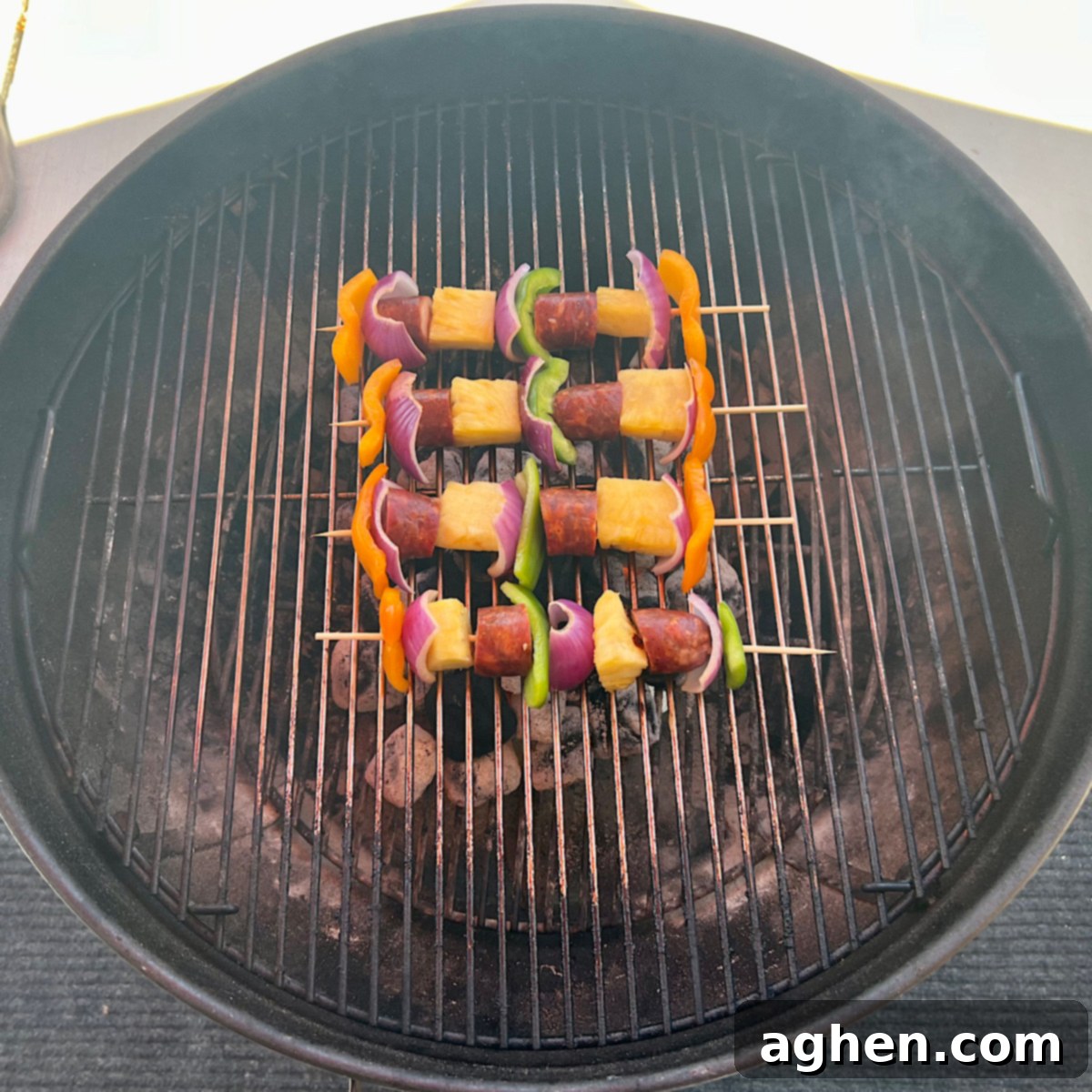 Grilled Tuna Skewers 7 Sausage and vegetable skewers grilling on a Weber Kettle