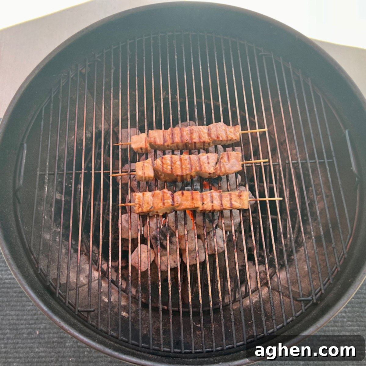 Grilled Tuna Skewers 8 Ahi tuna skewers grilling quickly on a hot Weber Kettle