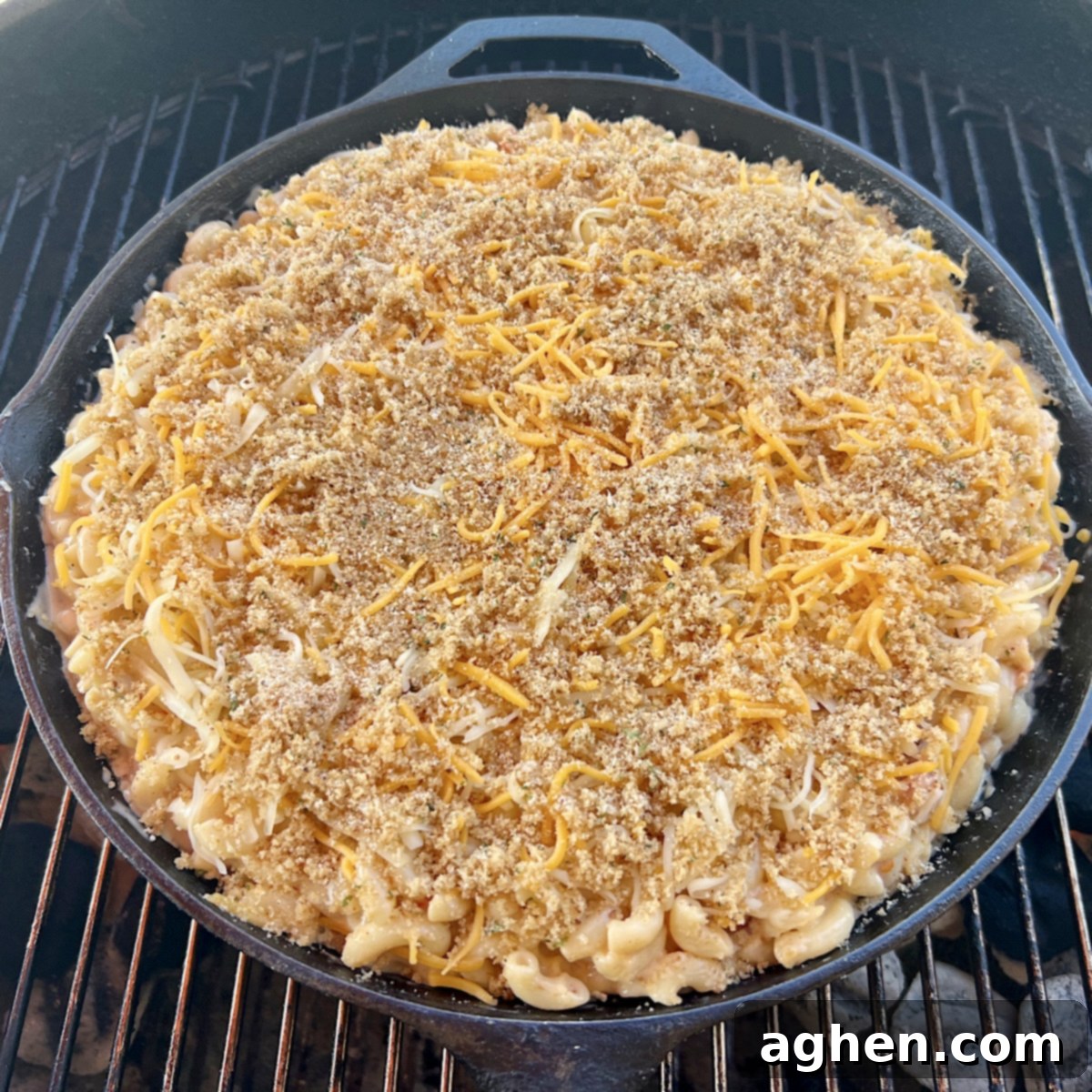 close up raw mac & cheese on grill grate