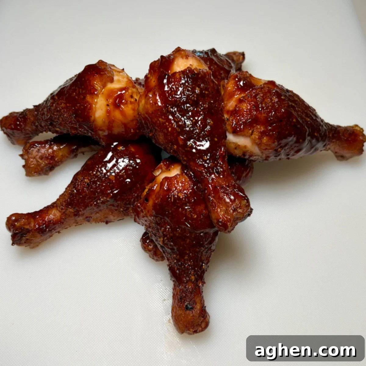 Ultimate Smoked Chicken Legs 2 finished smoked chicken drumsticks, perfectly glazed and ready to eat