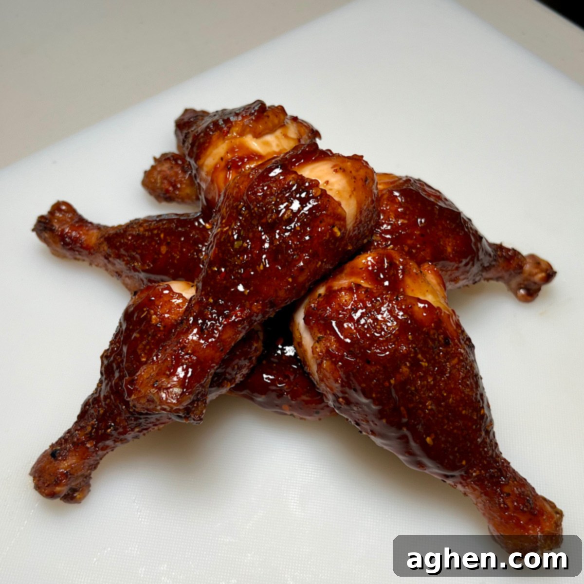 Ultimate Smoked Chicken Legs 11 finished smoked chicken drumsticks, glazed and piled on a serving platter