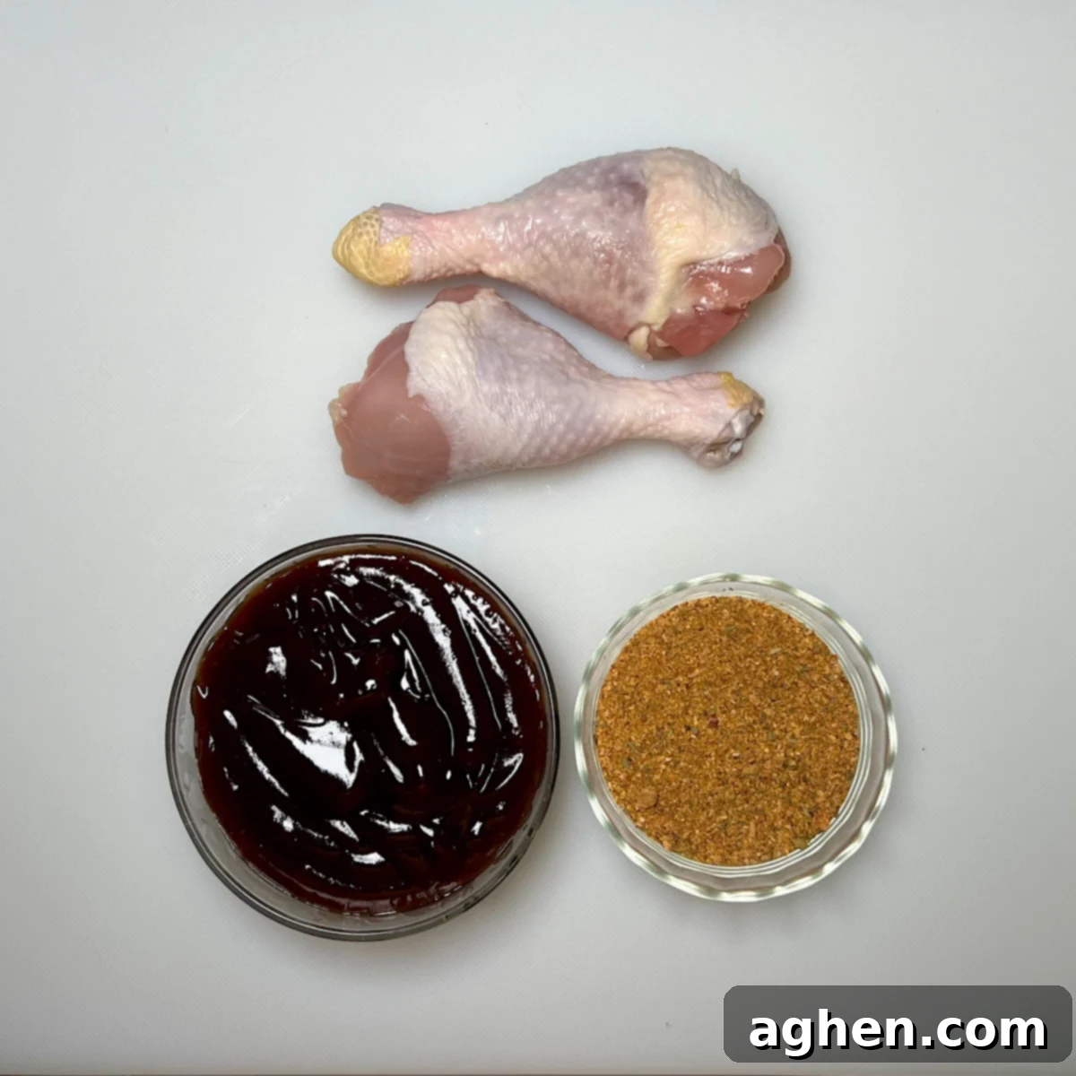 Ultimate Smoked Chicken Legs 3 smoked chicken drumsticks ingredients, including drumsticks, rub, and BBQ sauce