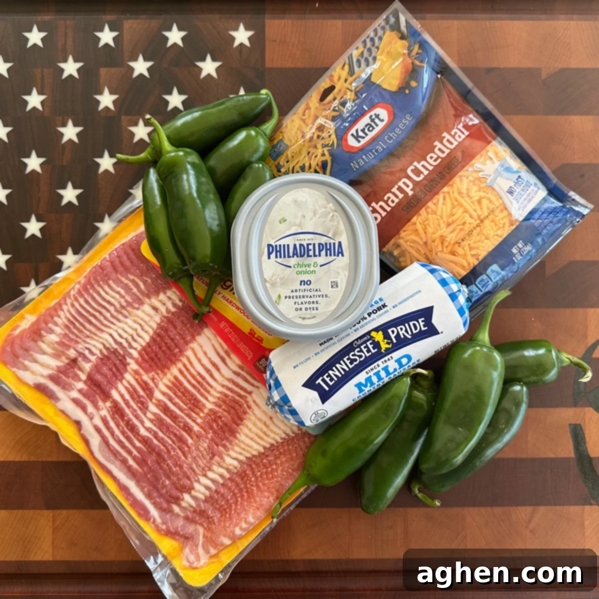 Fresh ingredients for Bacon-Wrapped Armadillo Eggs, including jalapeños, cream cheese, cheddar, sausage, and bacon.