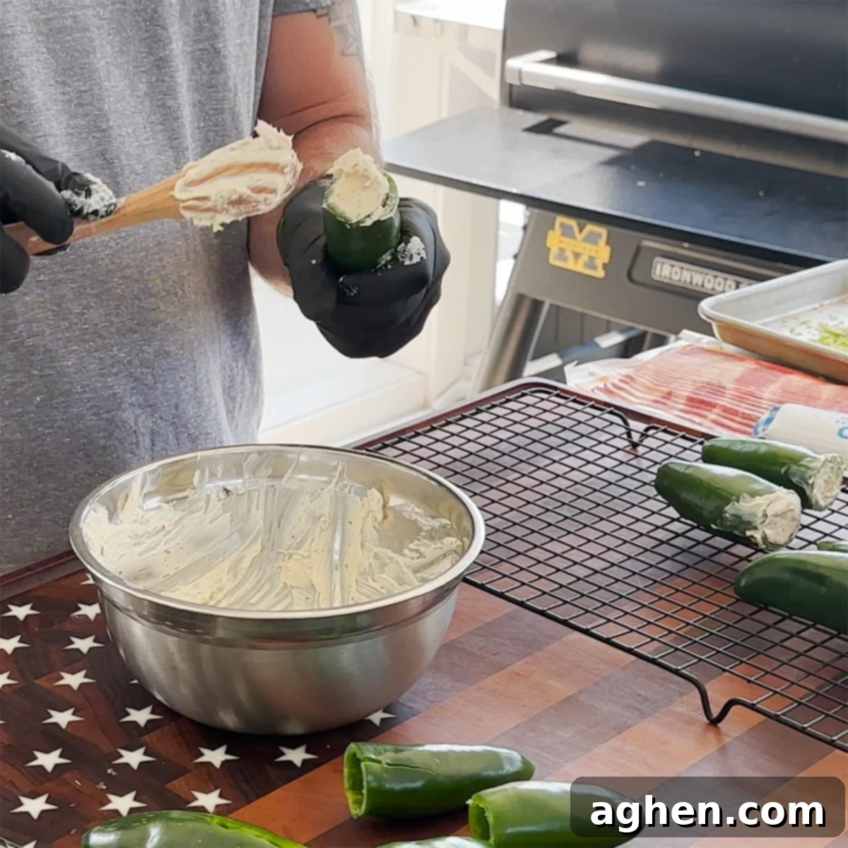 Stuffed jalapeños with creamy cheese filling, ready for the next step.