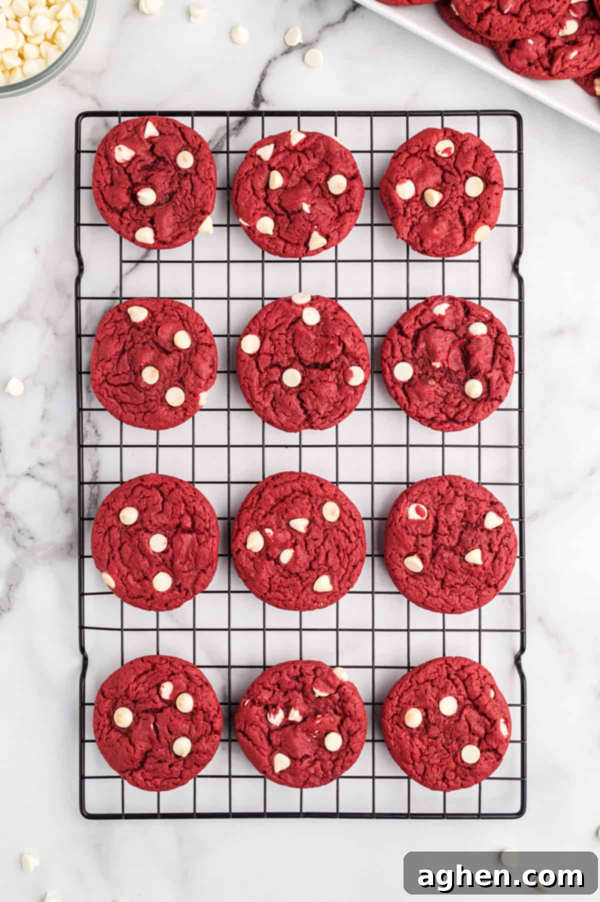 red velvet cake mix cookies with white chocolate chips on cooling rack