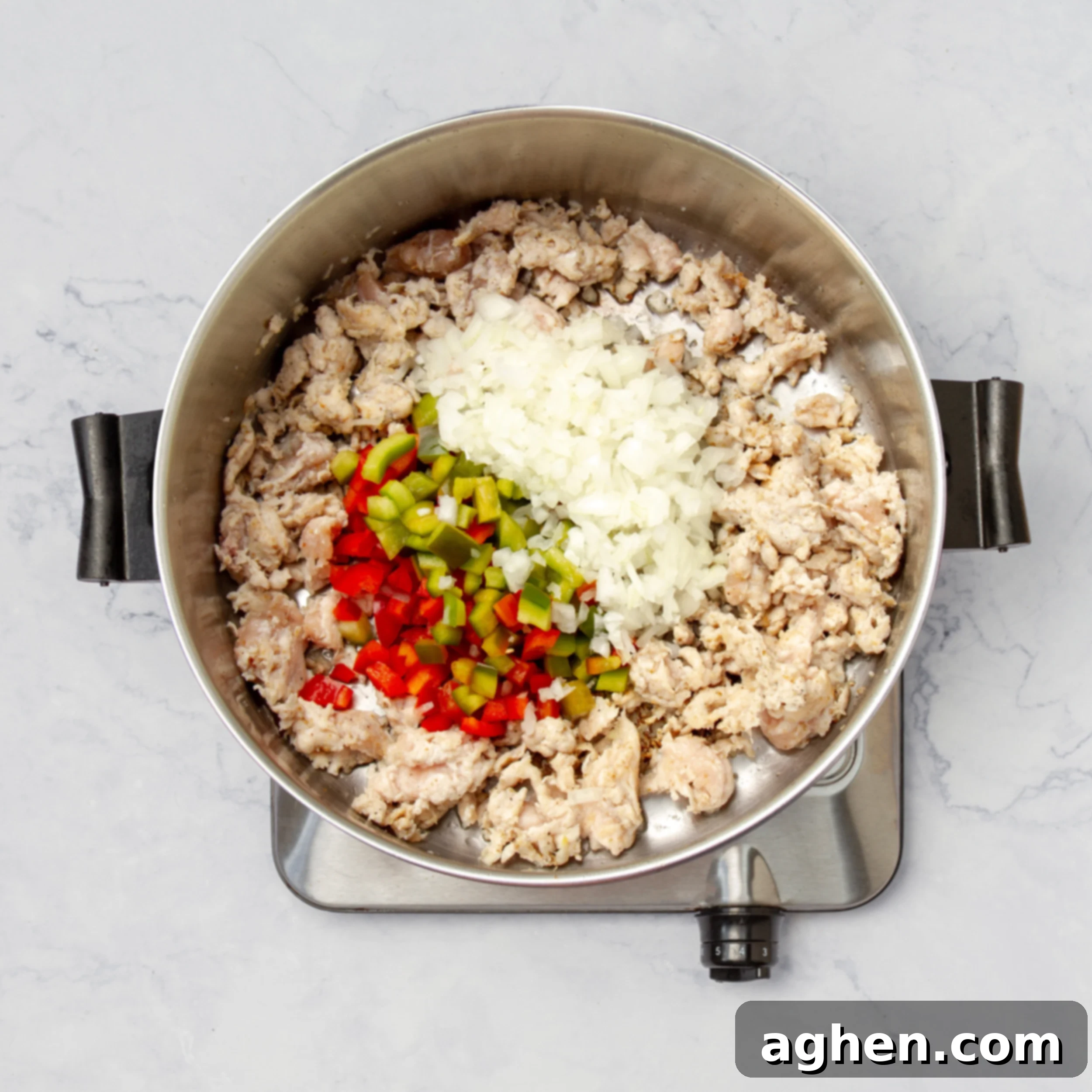Ground turkey and aromatics sauteing in the pot. 