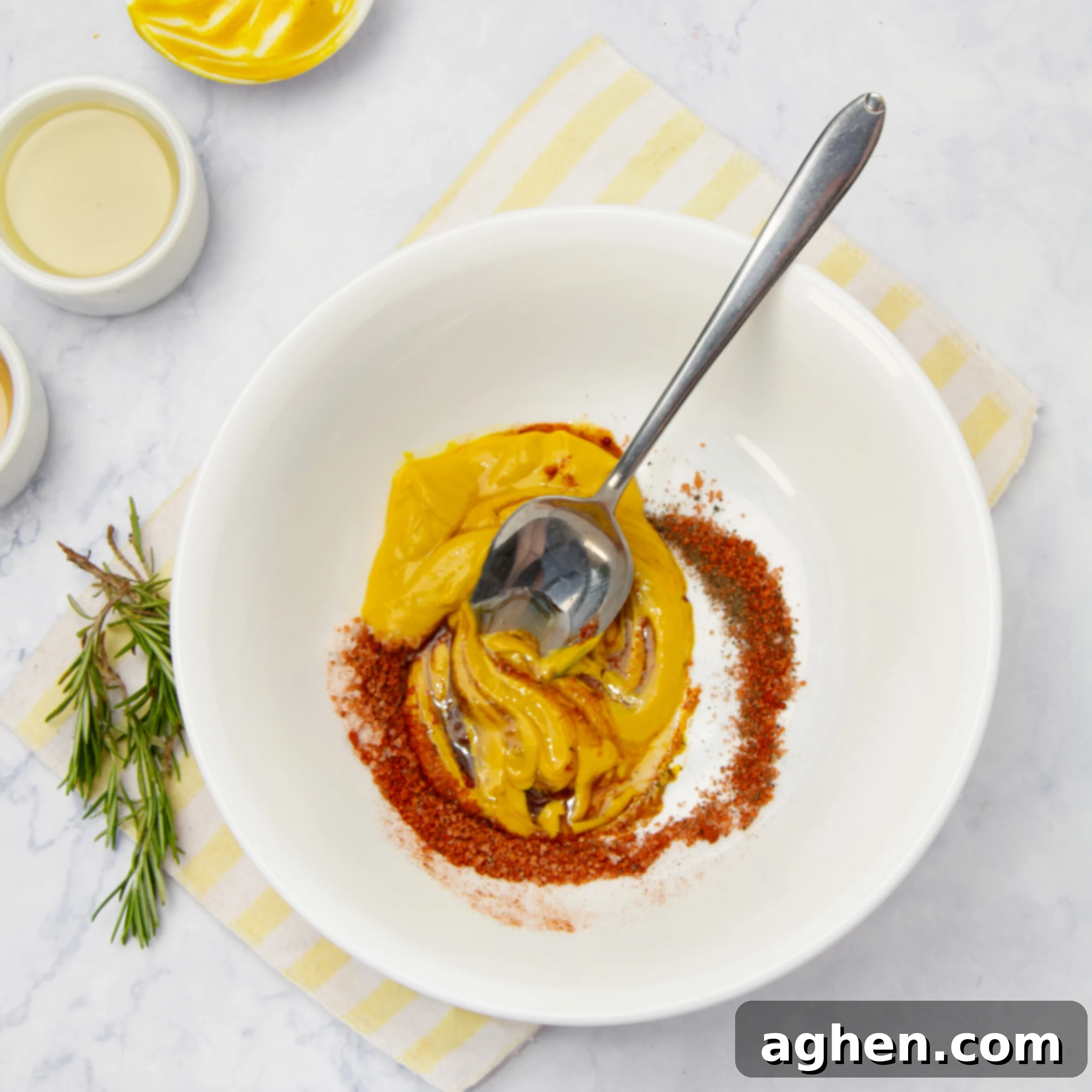 Ingredients for the honey mustard dressing in a small bowl, ready to be mixed.