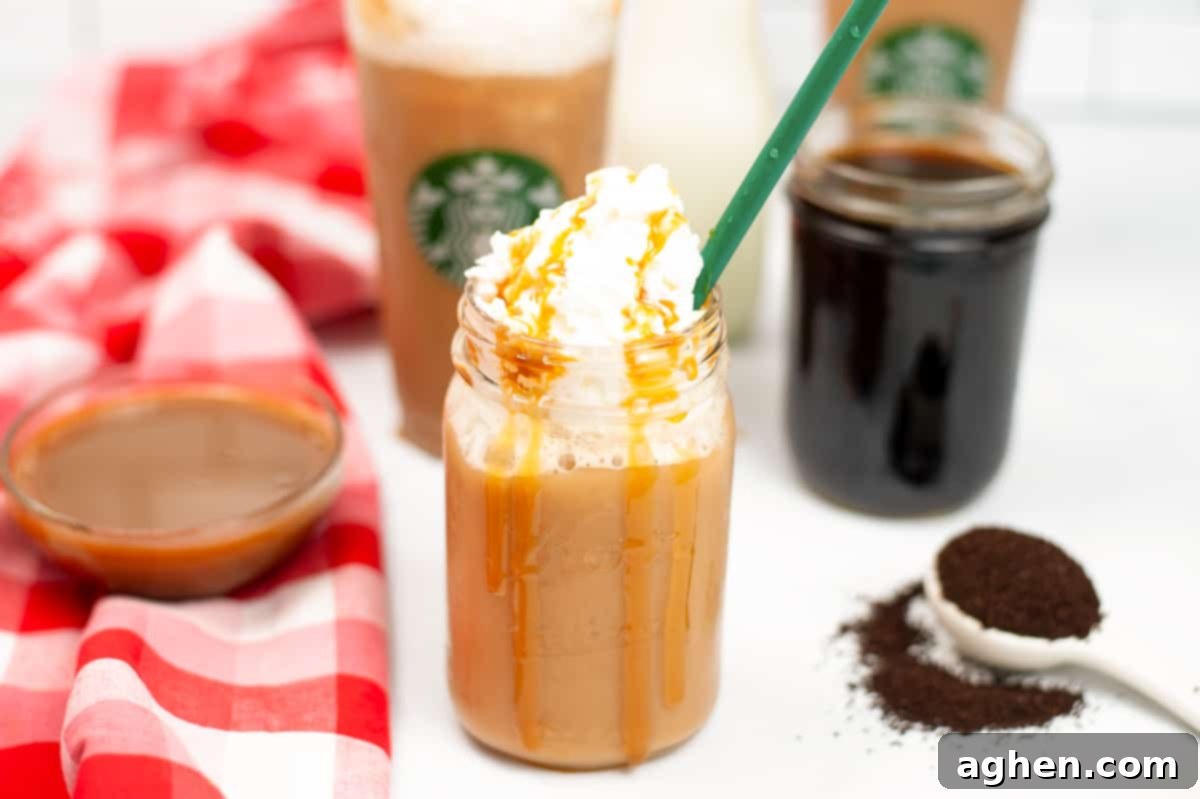 Frosted Caramel Delight 5 Caramel frappuccino with whipped cream and green straw. Additional cups and a bowl of caramel syrup, cold coffee, and coffee grinds are in background.