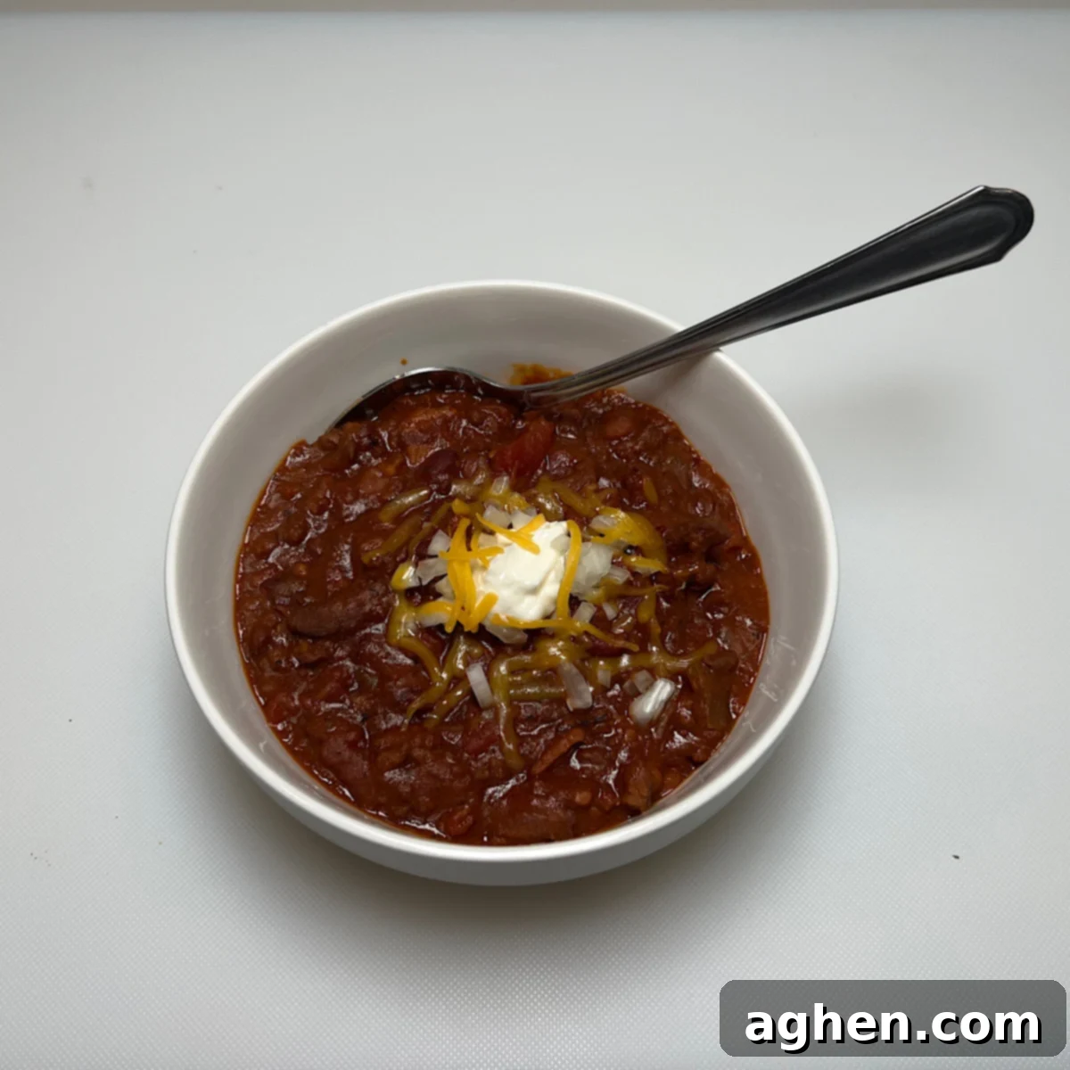smoked chili in white bowl with spoon