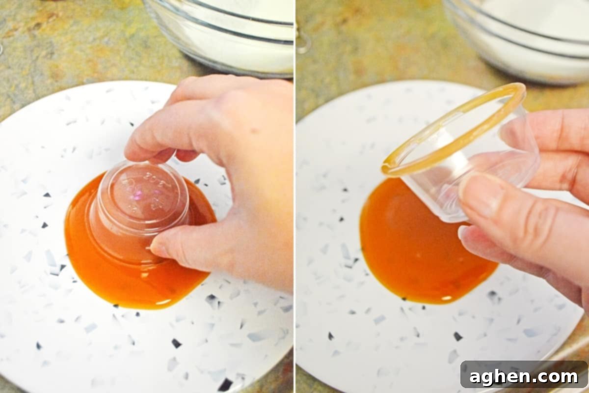 2 image collage: on left, hand dipping plastic shot glass in pool of caramel sauce on plate. On right: hand lifting glass out of caramel to show the covered rim.